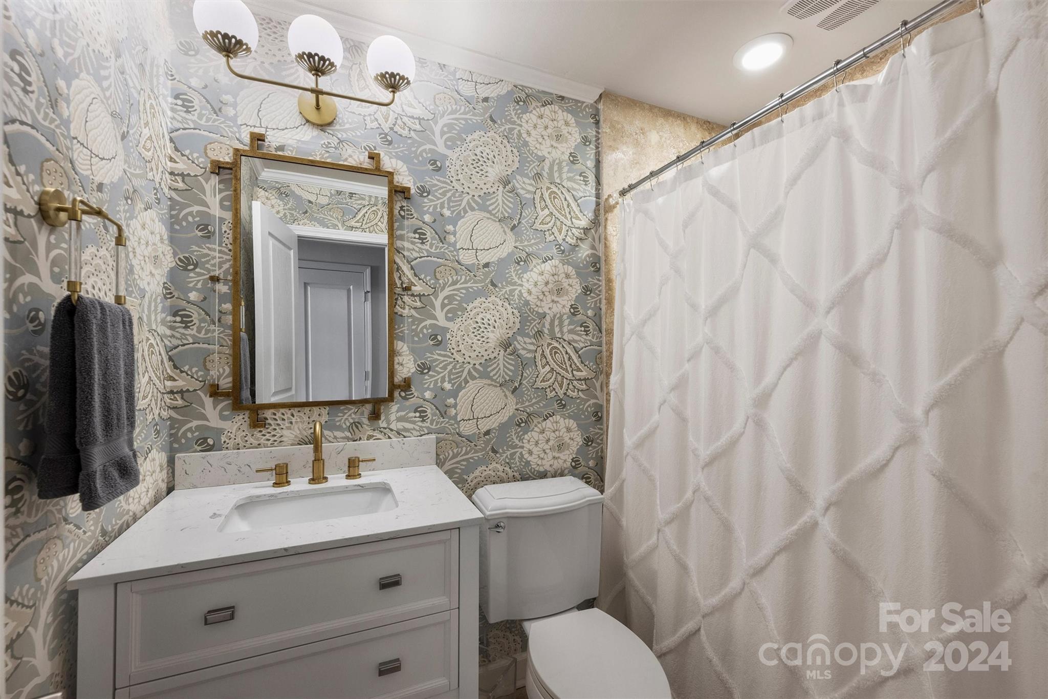 4115 Sulkirk Road Charlotte, NC 28210 - Photo 29 of 39 a bathroom with a granite countertop sink vanity mirror and shower
