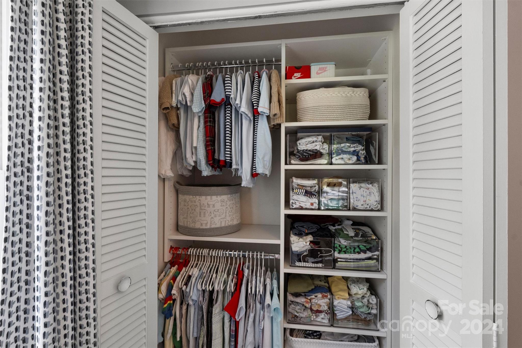4115 Sulkirk Road Charlotte, NC 28210 - Photo 30 of 39 a view of walk in closet with clothes and shoes