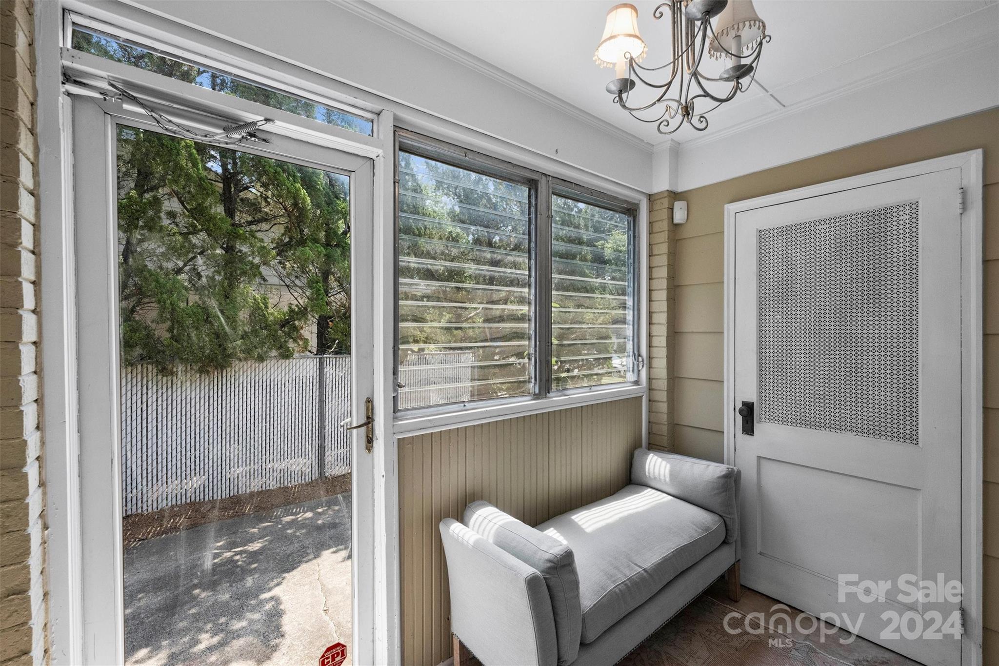4115 Sulkirk Road Charlotte, NC 28210 - Photo 31 of 39 a living room with furniture and a floor to ceiling window