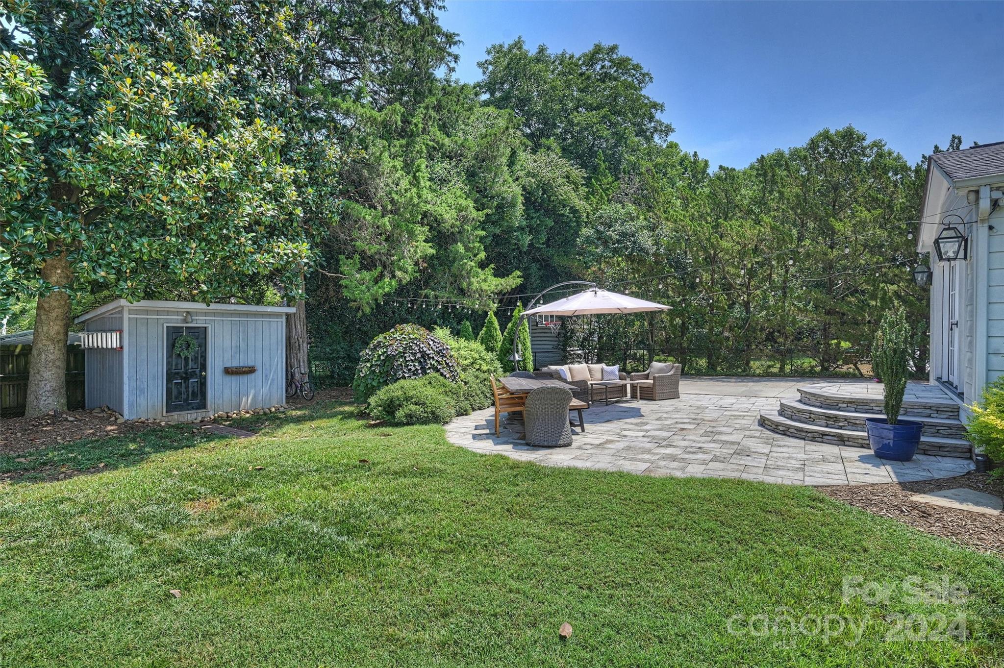 4115 Sulkirk Road Charlotte, NC 28210 - Photo 32 of 39 a view of a house with backyard and sitting area