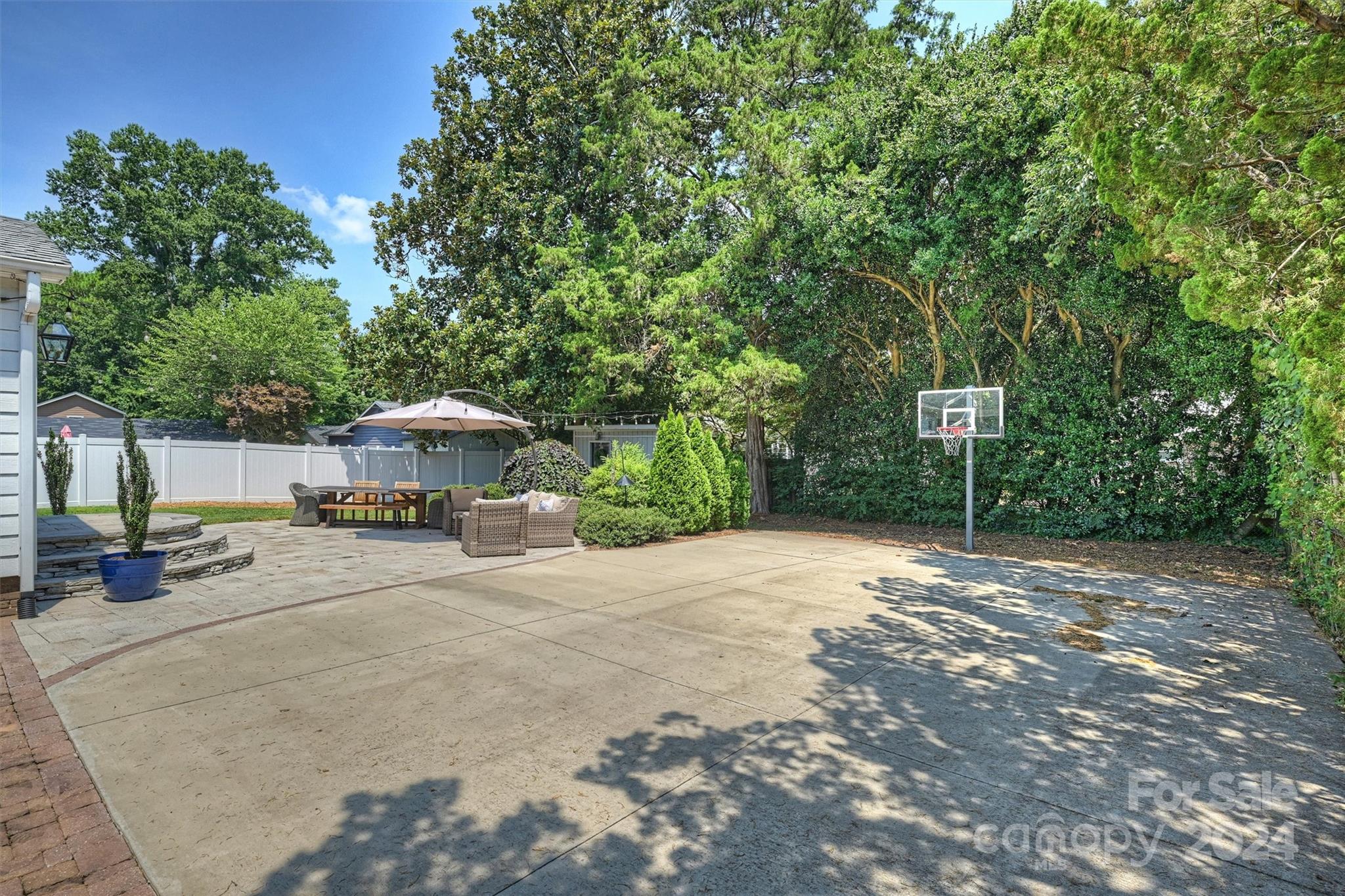 4115 Sulkirk Road Charlotte, NC 28210 - Photo 35 of 39 a view of a street with a bench and trees