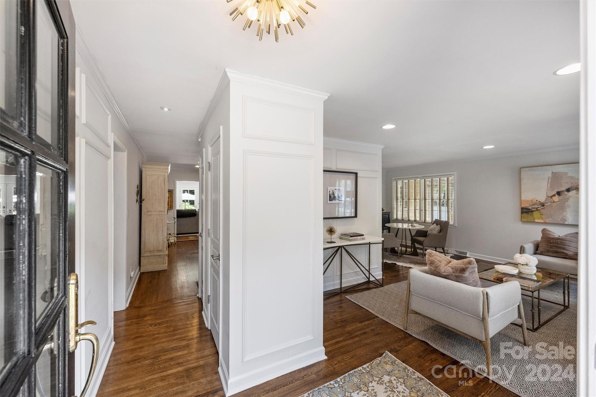 4115 Sulkirk Road Charlotte, NC 28210 - Photo 4 of 39 a living room with furniture wooden floor and a rug