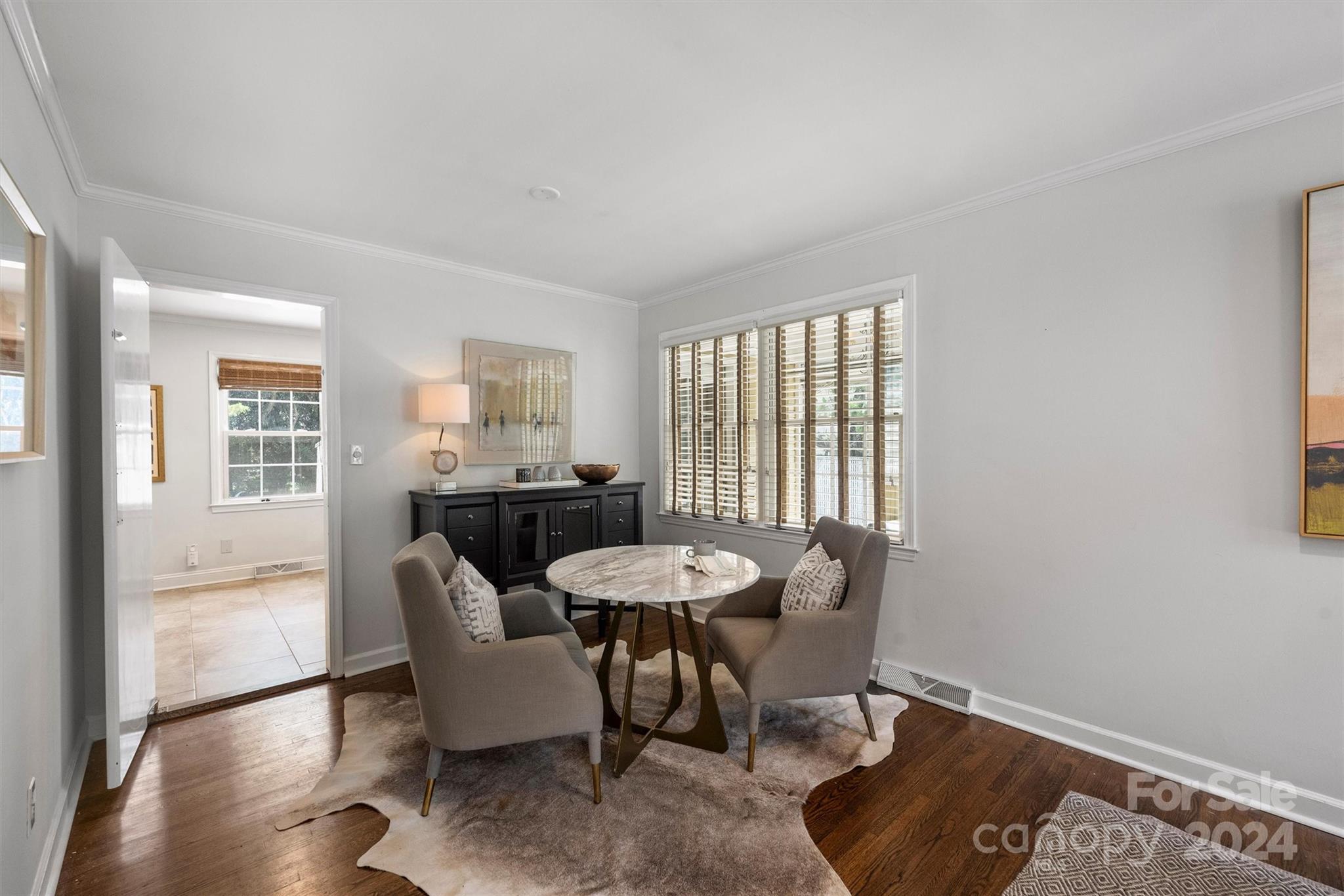 4115 Sulkirk Road Charlotte, NC 28210 - Photo 9 of 39 a dining room with furniture and wooden floor
