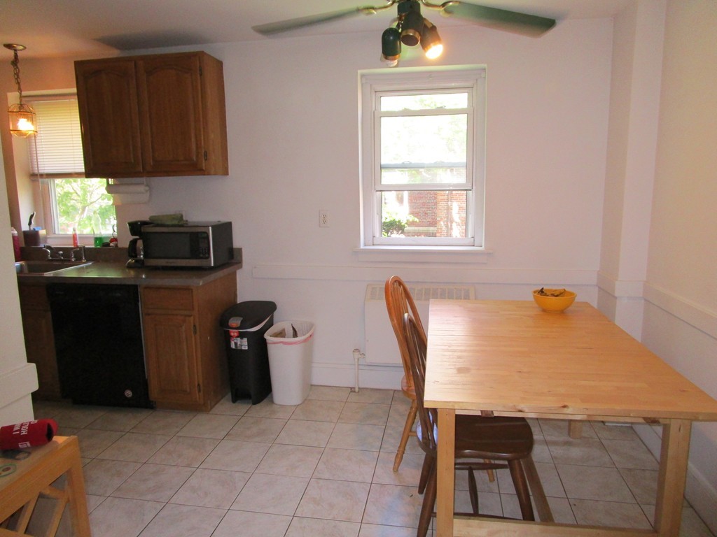 6 O'Leary Way, Unit 82 Boston, MA 02130 - Photo 6 of 14 a kitchen with a stove a refrigerator and a microwave