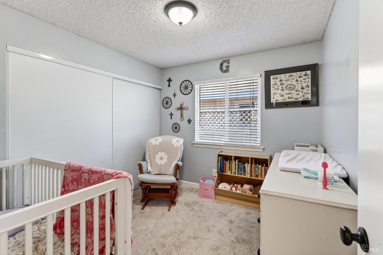 4526 Hillview Court Rohnert Park, CA 94928 - Photo 20 of 28 a bedroom with furniture and a window