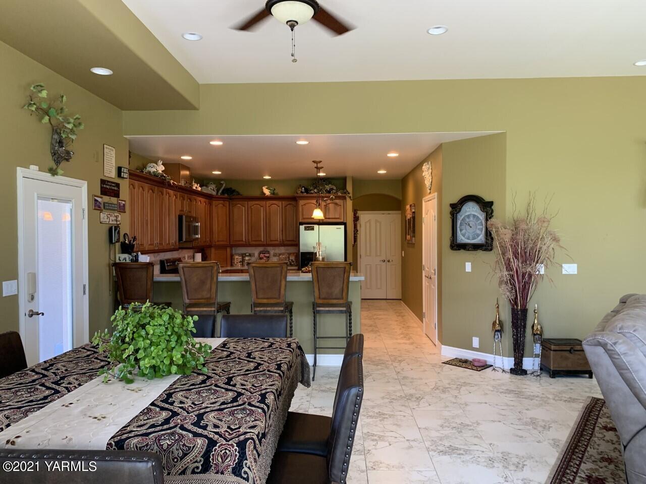 14841 Fisk Road Yakima, WA 98908 - Photo 28 of 59 a large kitchen with a table and chairs in it