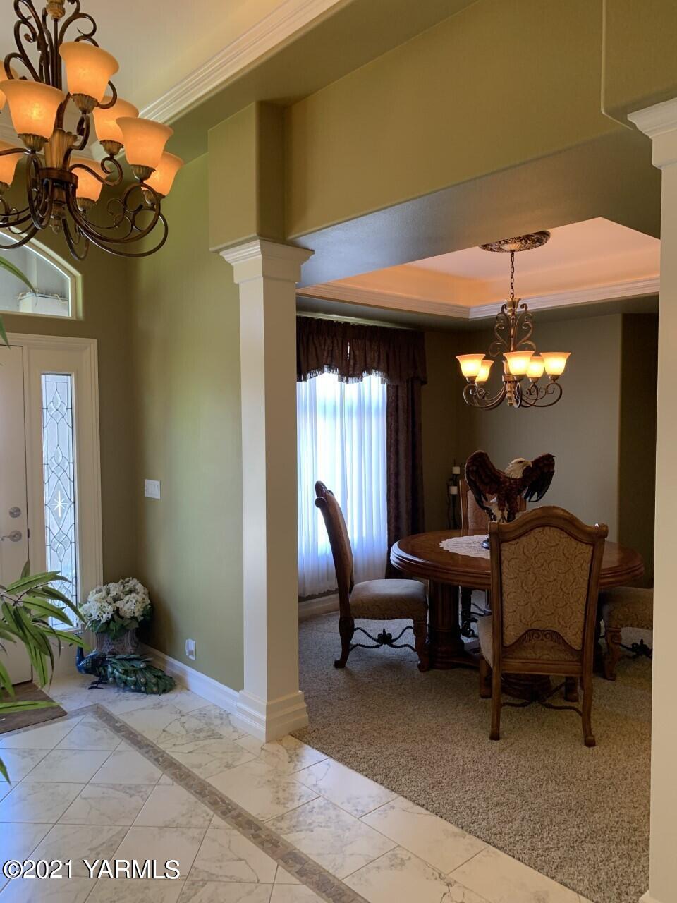 14841 Fisk Road Yakima, WA 98908 - Photo 38 of 59 a view of a dining room with furniture and chandelier