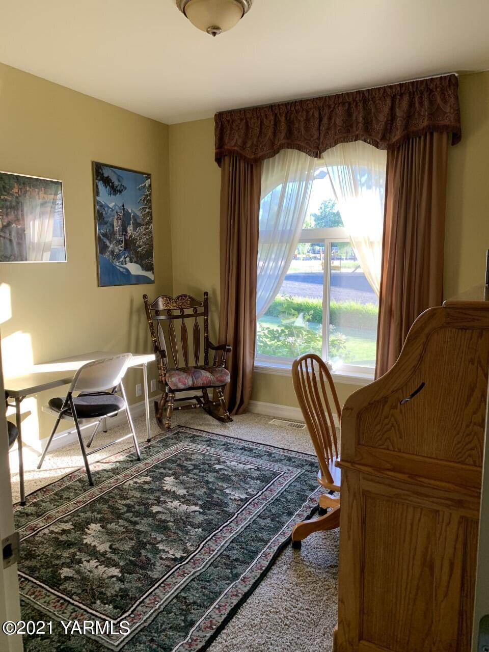 14841 Fisk Road Yakima, WA 98908 - Photo 48 of 59 a living room with furniture rug and a window