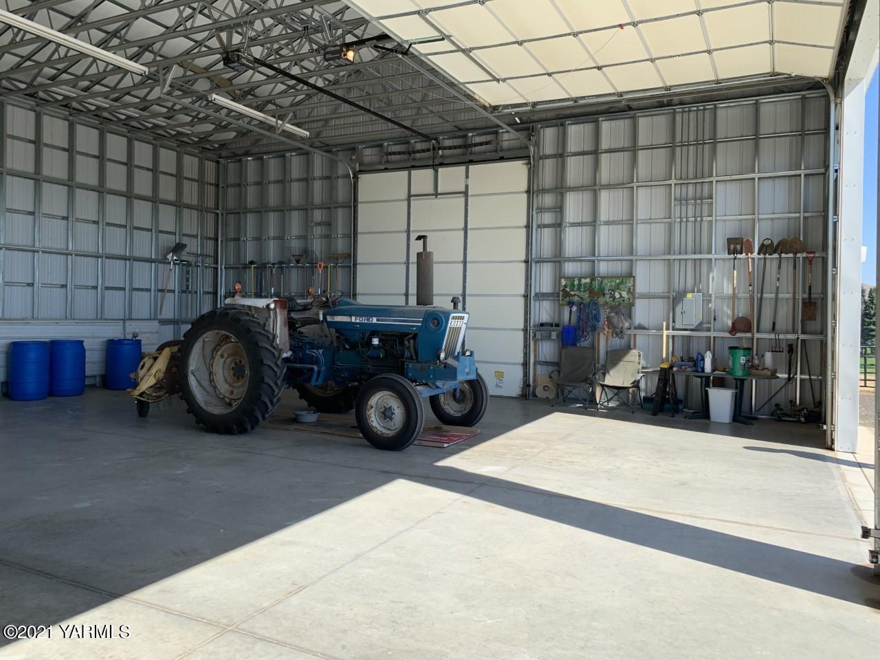 14841 Fisk Road Yakima, WA 98908 - Photo 51 of 59 a view of a garage with a table and a chairs