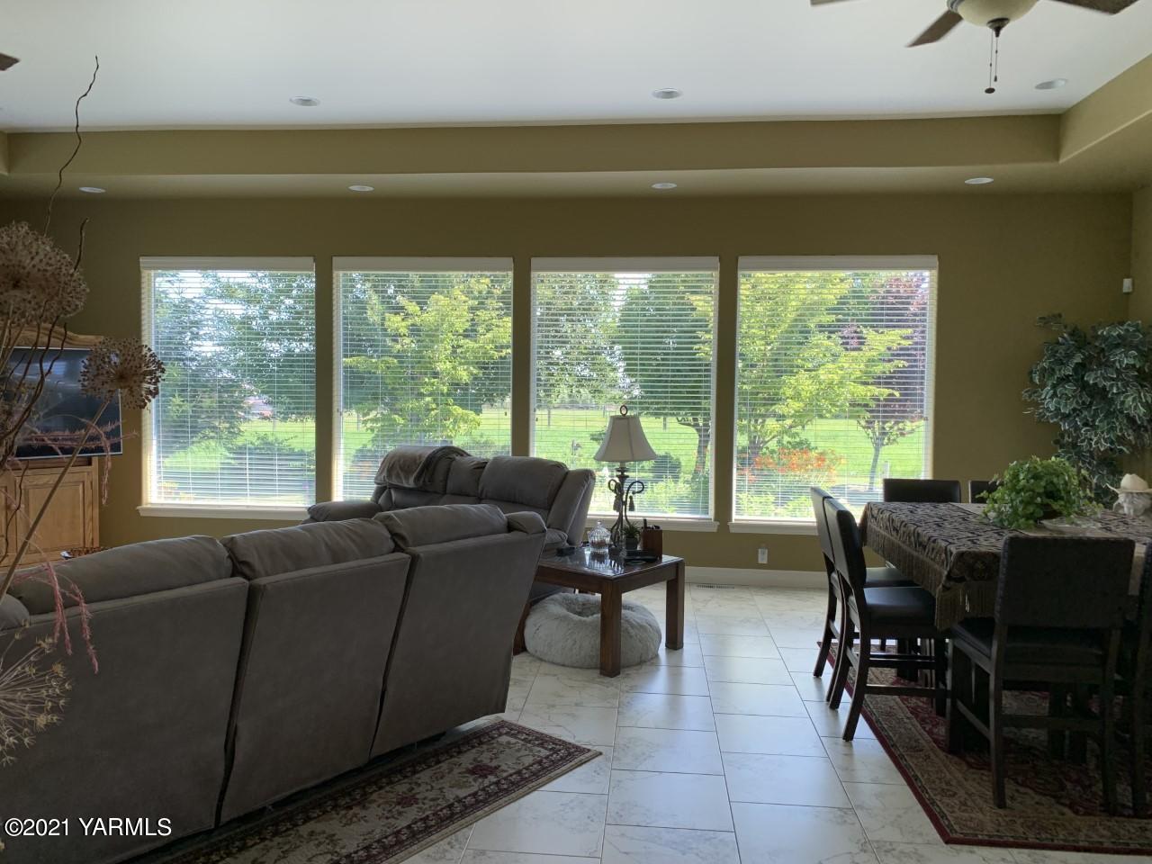14841 Fisk Road Yakima, WA 98908 - Photo 8 of 59 a living room with furniture and a large window