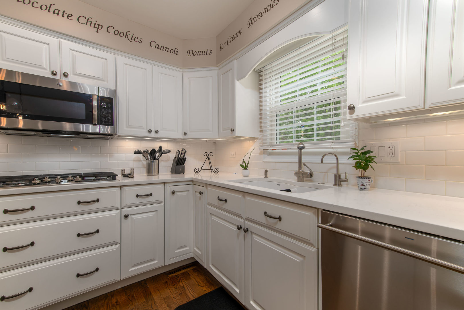 1608 Grommon Road Naperville, IL 60564 - Photo 15 of 48 a kitchen with stainless steel appliances white cabinets and a sink