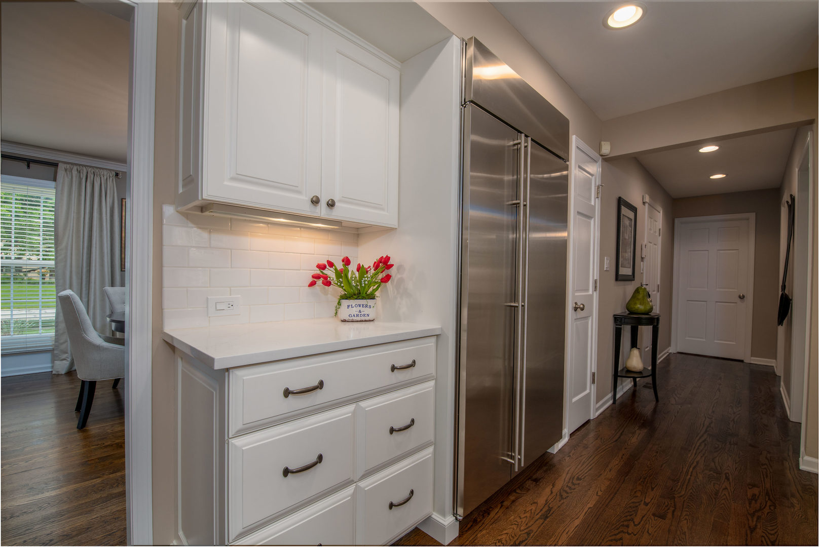 1608 Grommon Road Naperville, IL 60564 - Photo 16 of 48 a hallway with cabinet and wooden floor