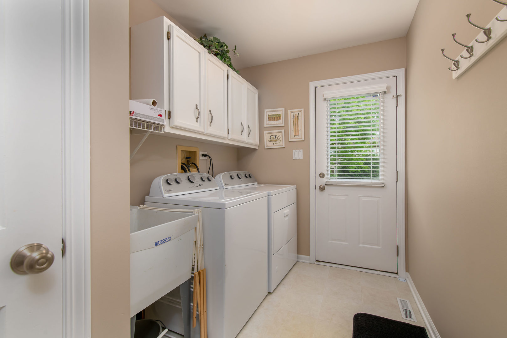 1608 Grommon Road Naperville, IL 60564 - Photo 19 of 48 a utility room with cabinets washer and dryer