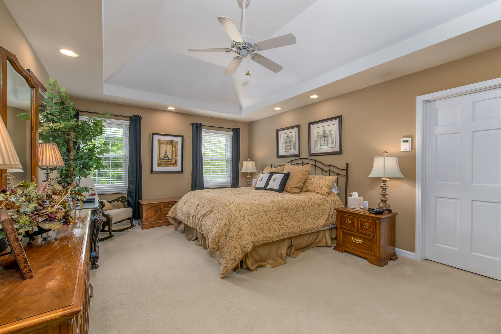 1608 Grommon Road Naperville, IL 60564 - Photo 22 of 48 a spacious bedroom with a bed and a chandelier