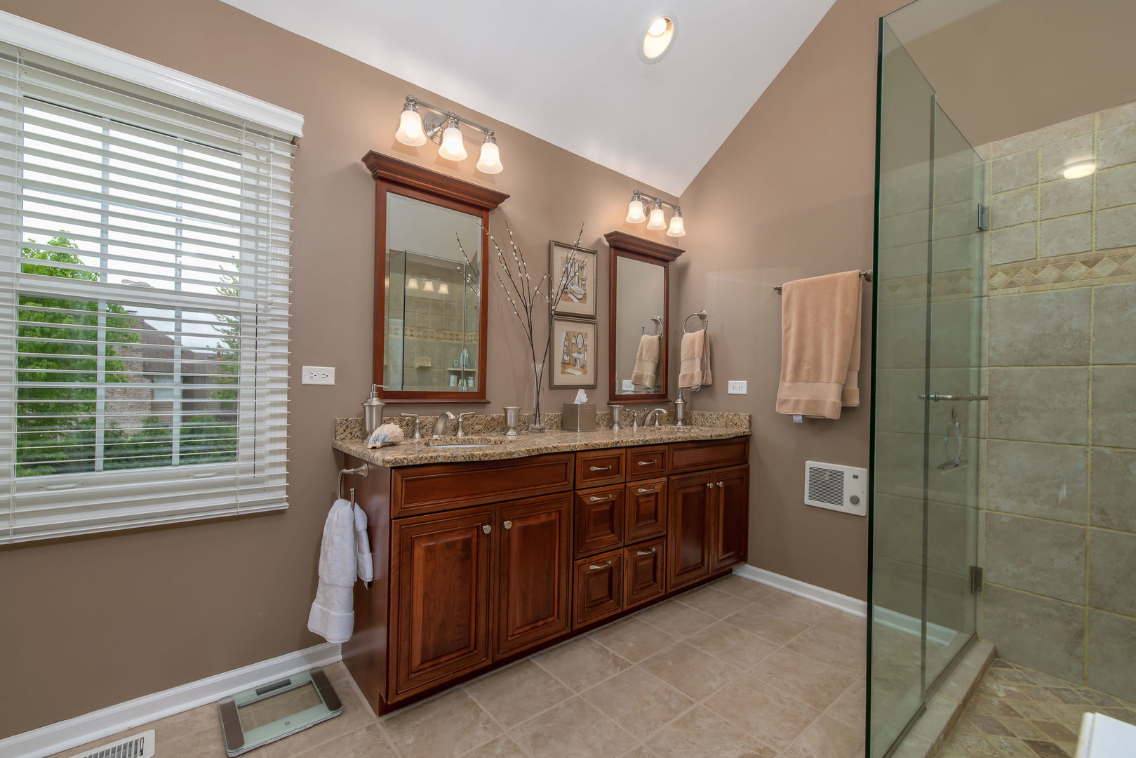 1608 Grommon Road Naperville, IL 60564 - Photo 24 of 48 a spacious bathroom with a double vanity sink a large mirror and a bathtub