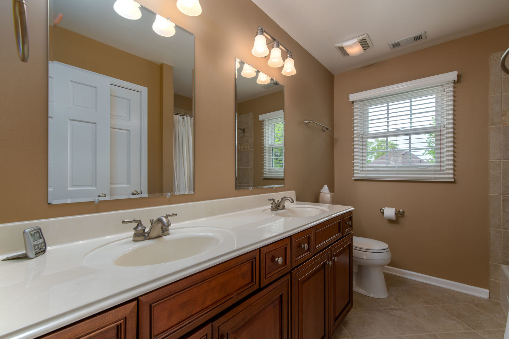1608 Grommon Road Naperville, IL 60564 - Photo 30 of 48 a bathroom with a sink double vanity granite and a toilet