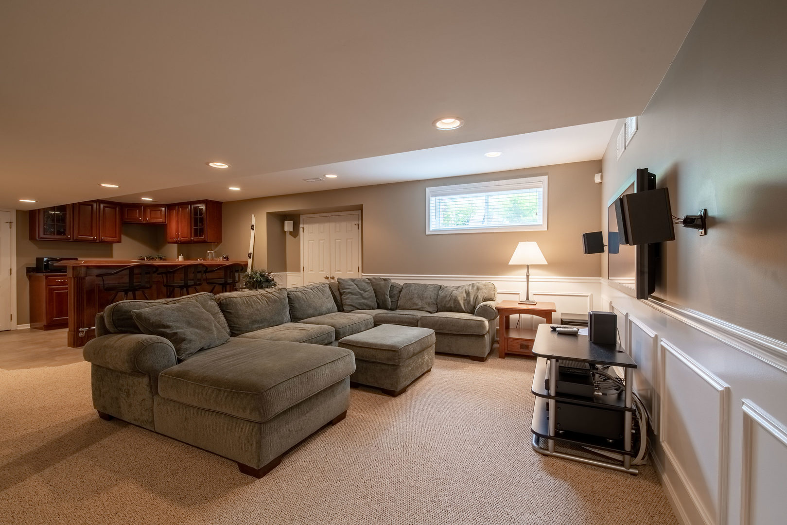1608 Grommon Road Naperville, IL 60564 - Photo 32 of 48 a living room with furniture and a flat screen tv