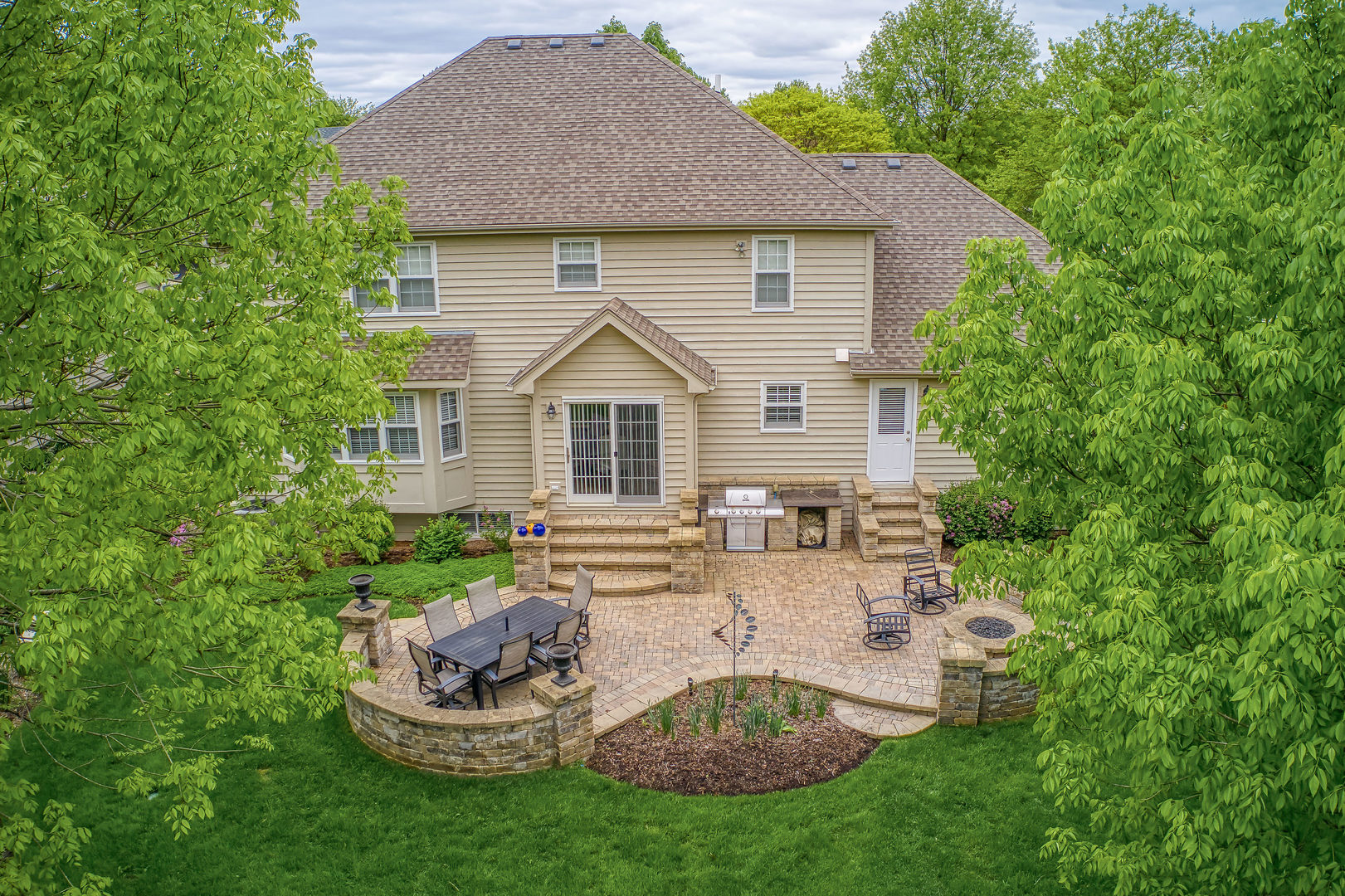 1608 Grommon Road Naperville, IL 60564 - Photo 42 of 48 a view of a house with a yard patio and fire pit