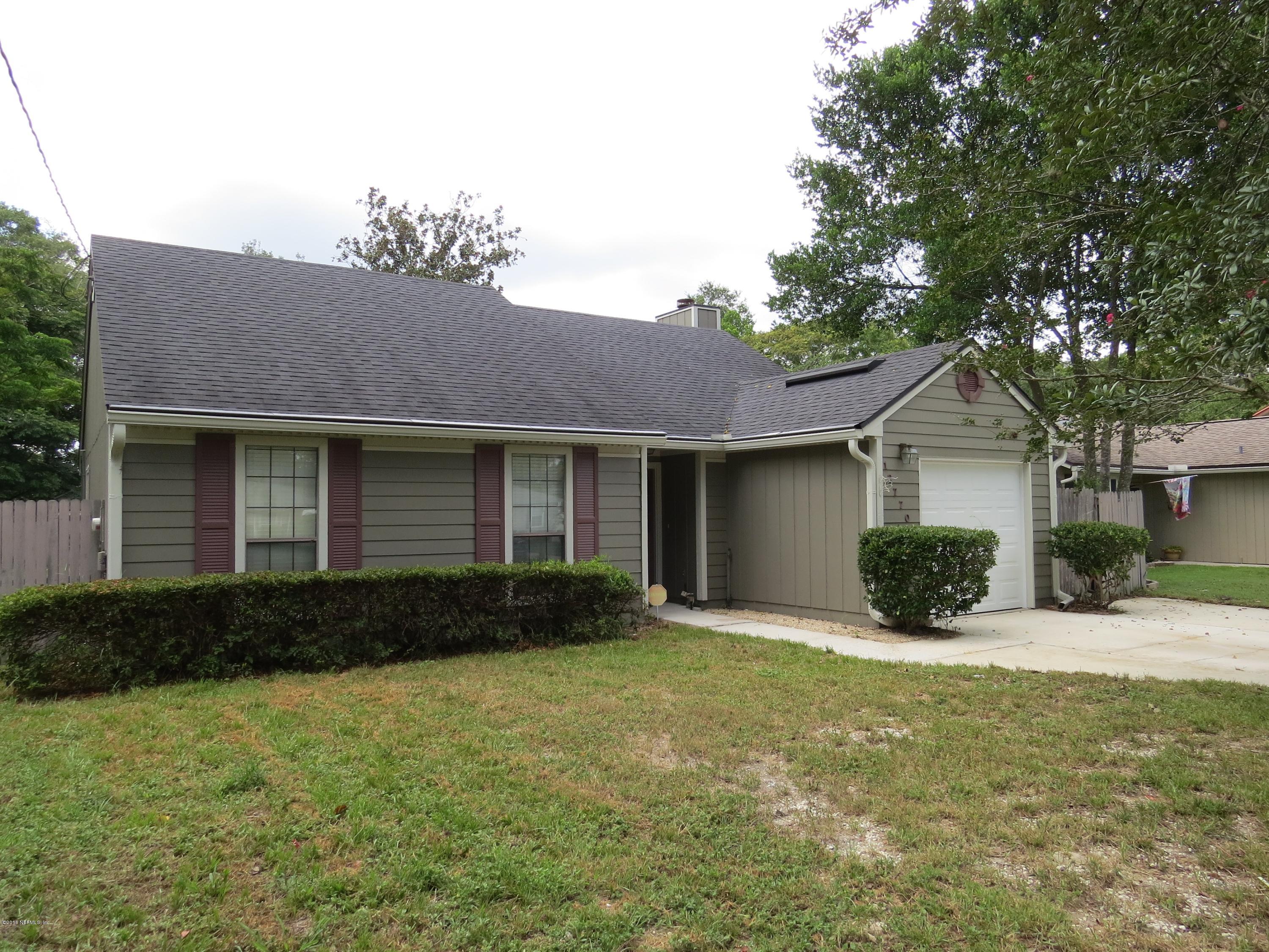 12770 Beaubien Road Jacksonville, FL 32258 - Photo 1 of 46 a front view of a house with garden