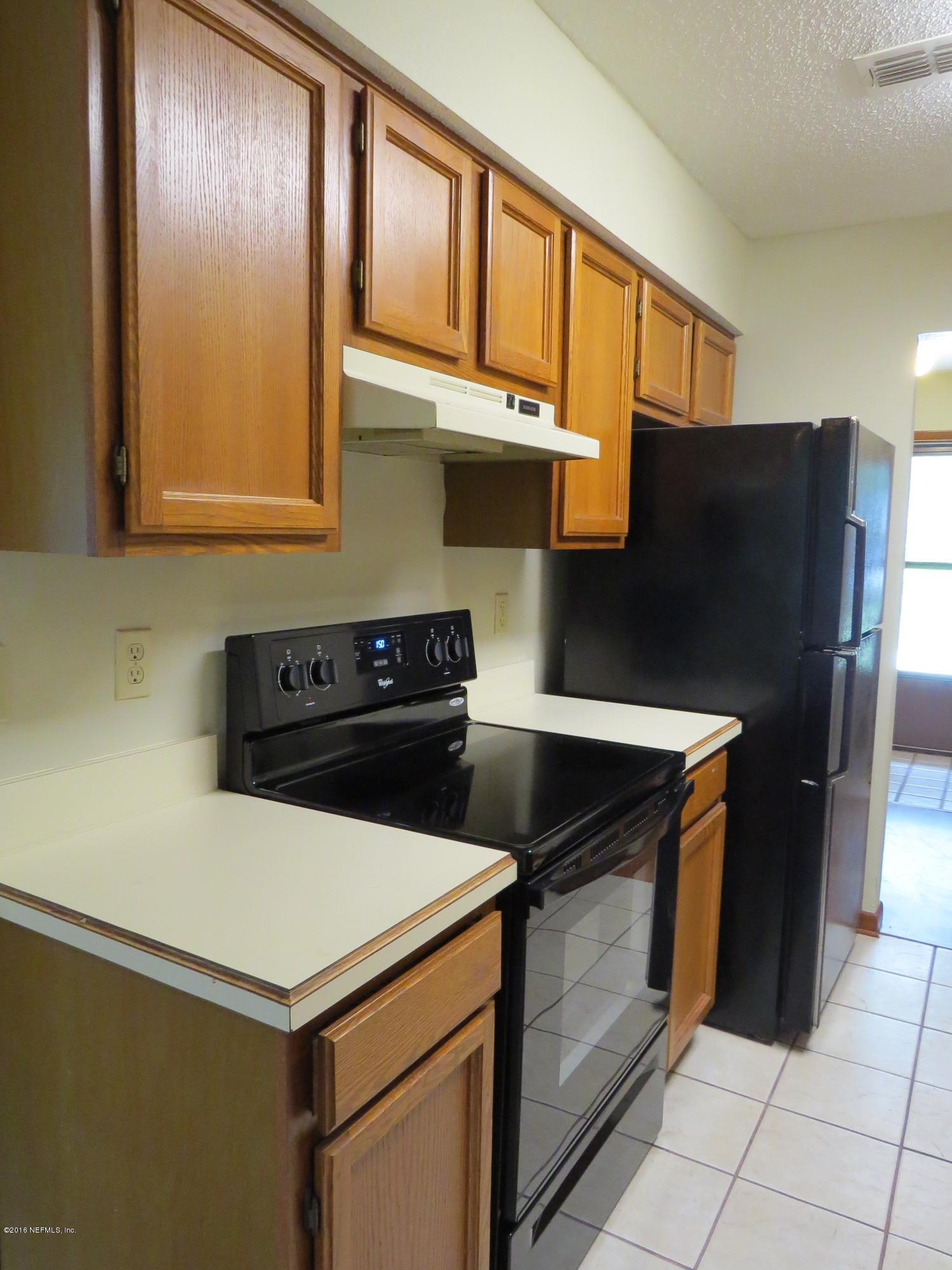 12770 Beaubien Road Jacksonville, FL 32258 - Photo 17 of 46 a kitchen with stainless steel appliances a refrigerator and a stove