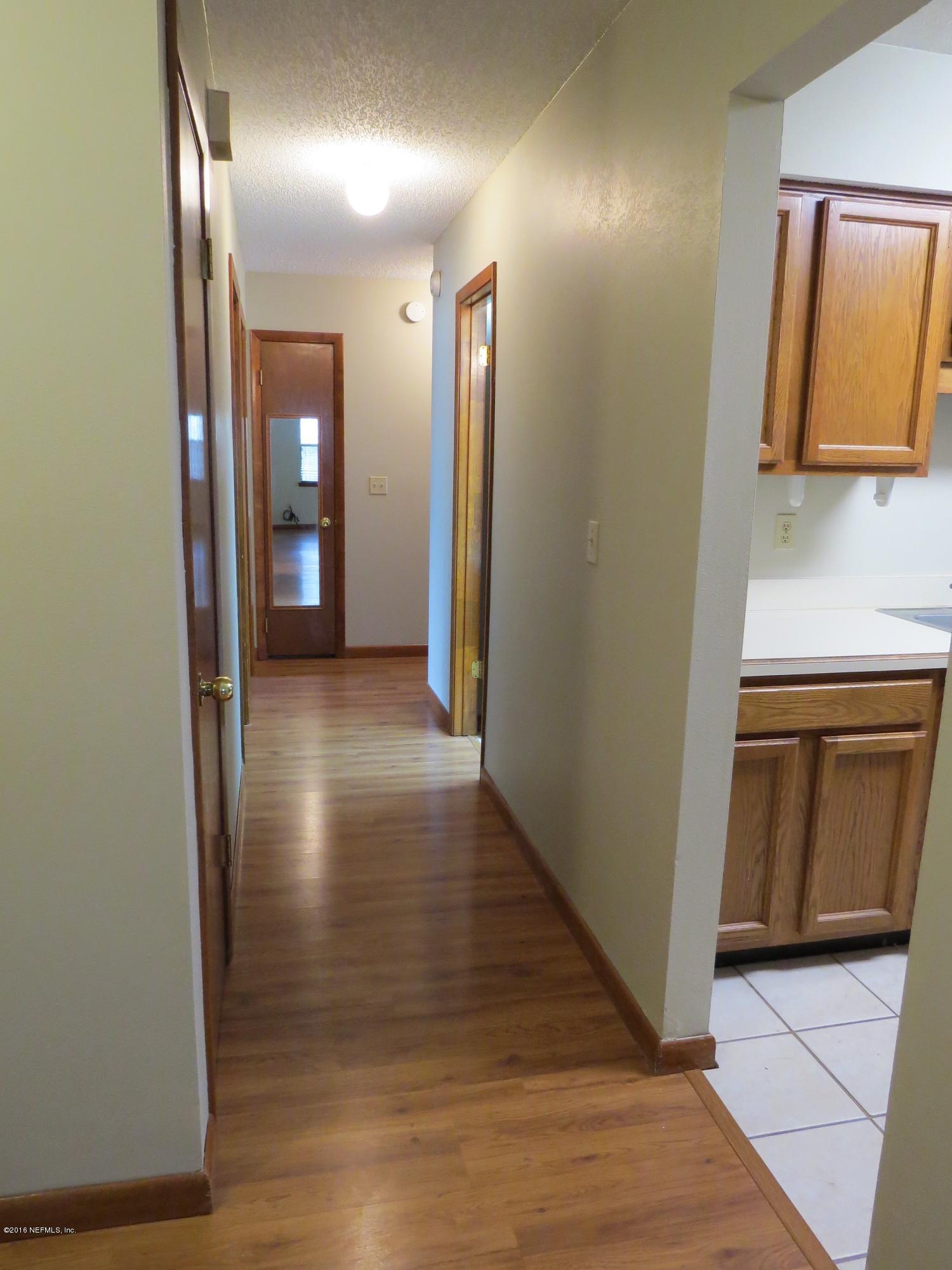 12770 Beaubien Road Jacksonville, FL 32258 - Photo 19 of 46 a view of a hallway with wooden floor