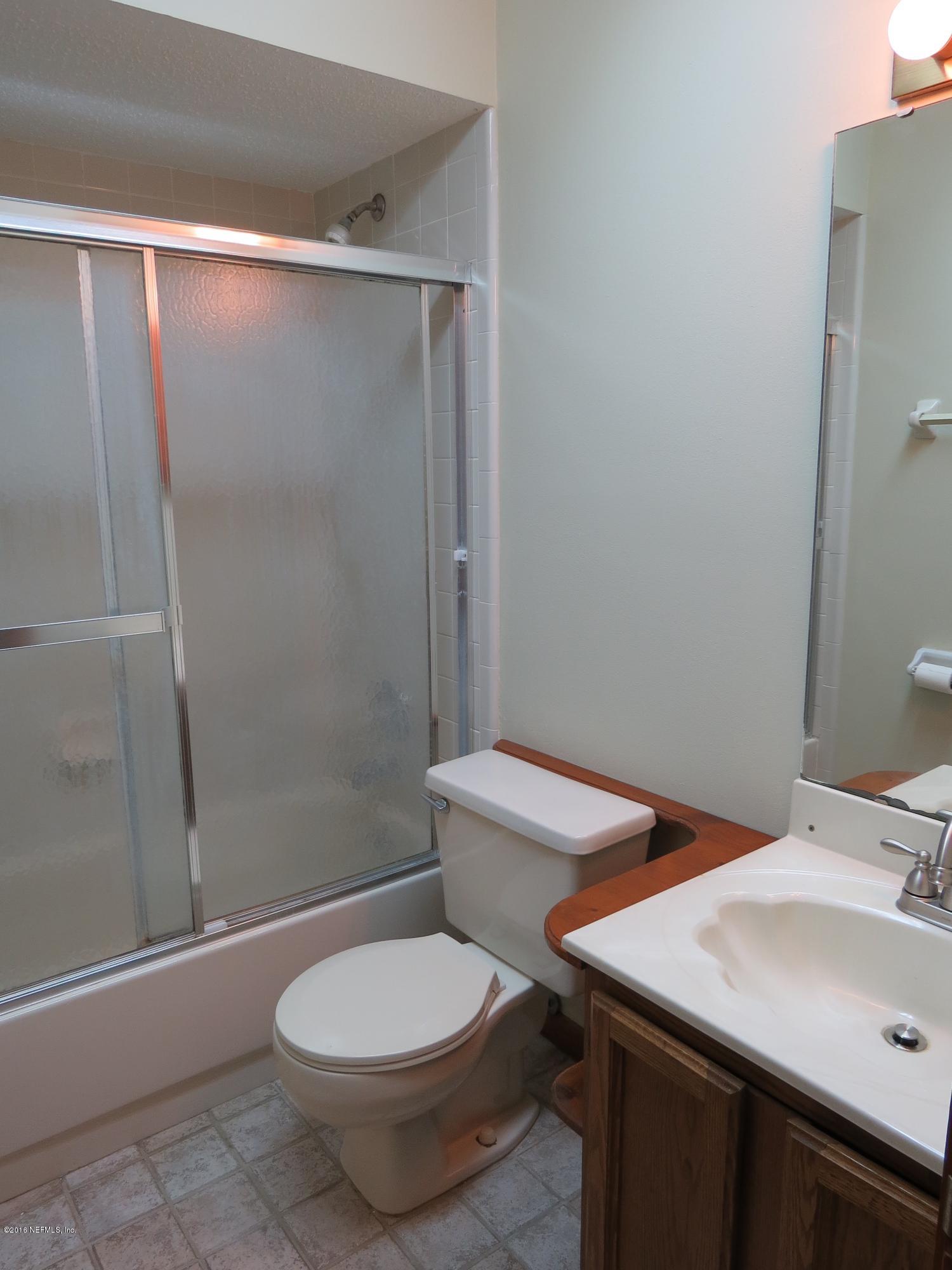 12770 Beaubien Road Jacksonville, FL 32258 - Photo 20 of 46 a bathroom with a sink and toilet