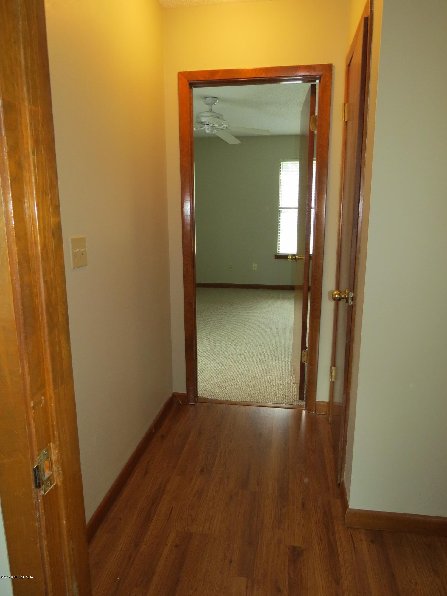 12770 Beaubien Road Jacksonville, FL 32258 - Photo 26 of 46 a view of empty room with wooden floor
