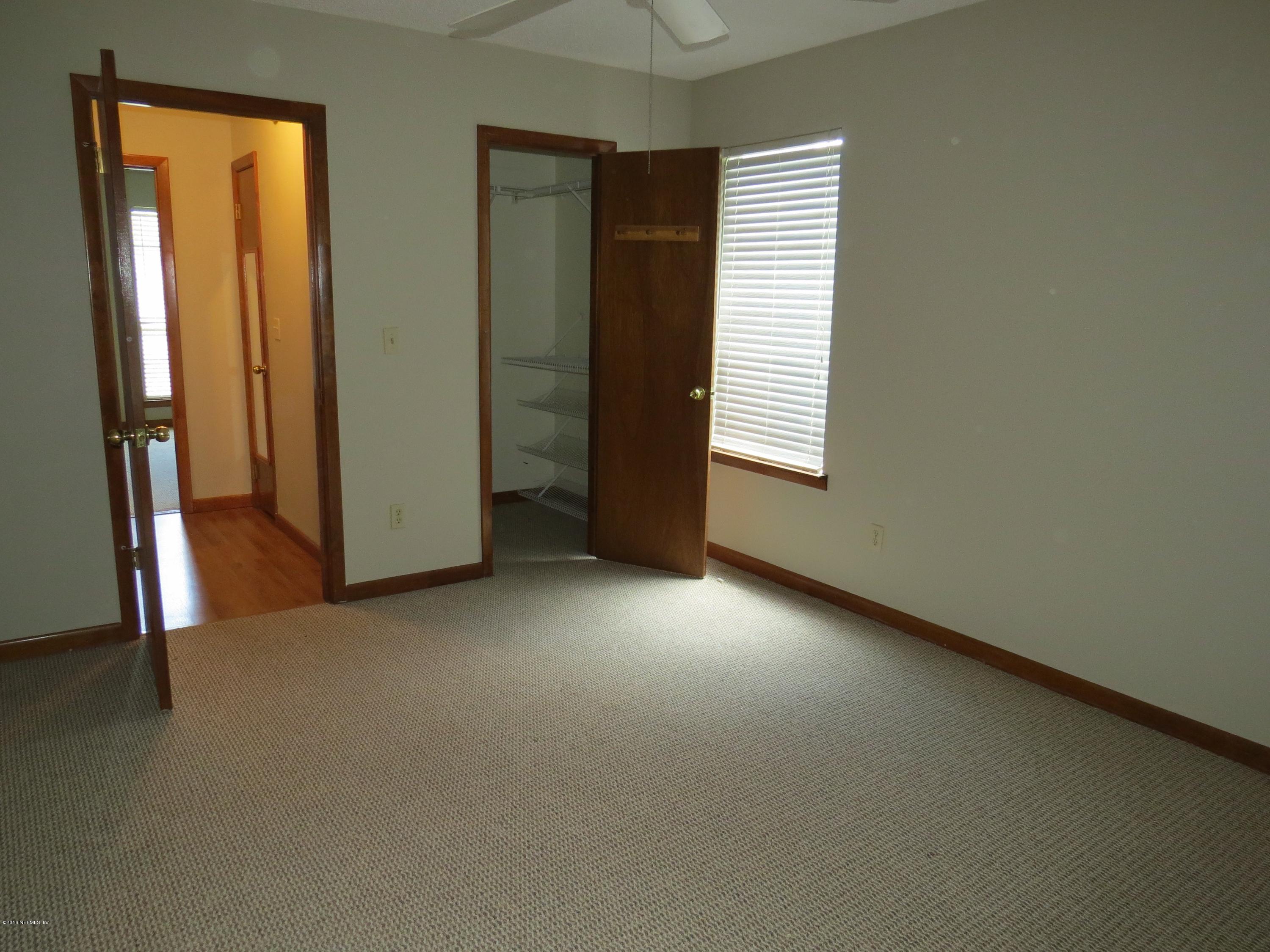 12770 Beaubien Road Jacksonville, FL 32258 - Photo 29 of 46 an empty room with windows and closet