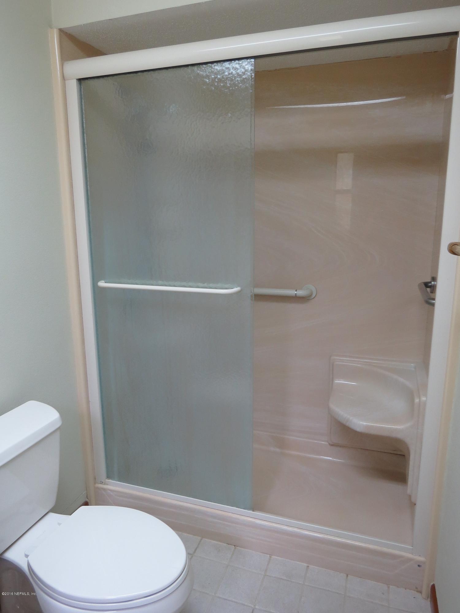 12770 Beaubien Road Jacksonville, FL 32258 - Photo 30 of 46 a white toilet and shower in a bathroom