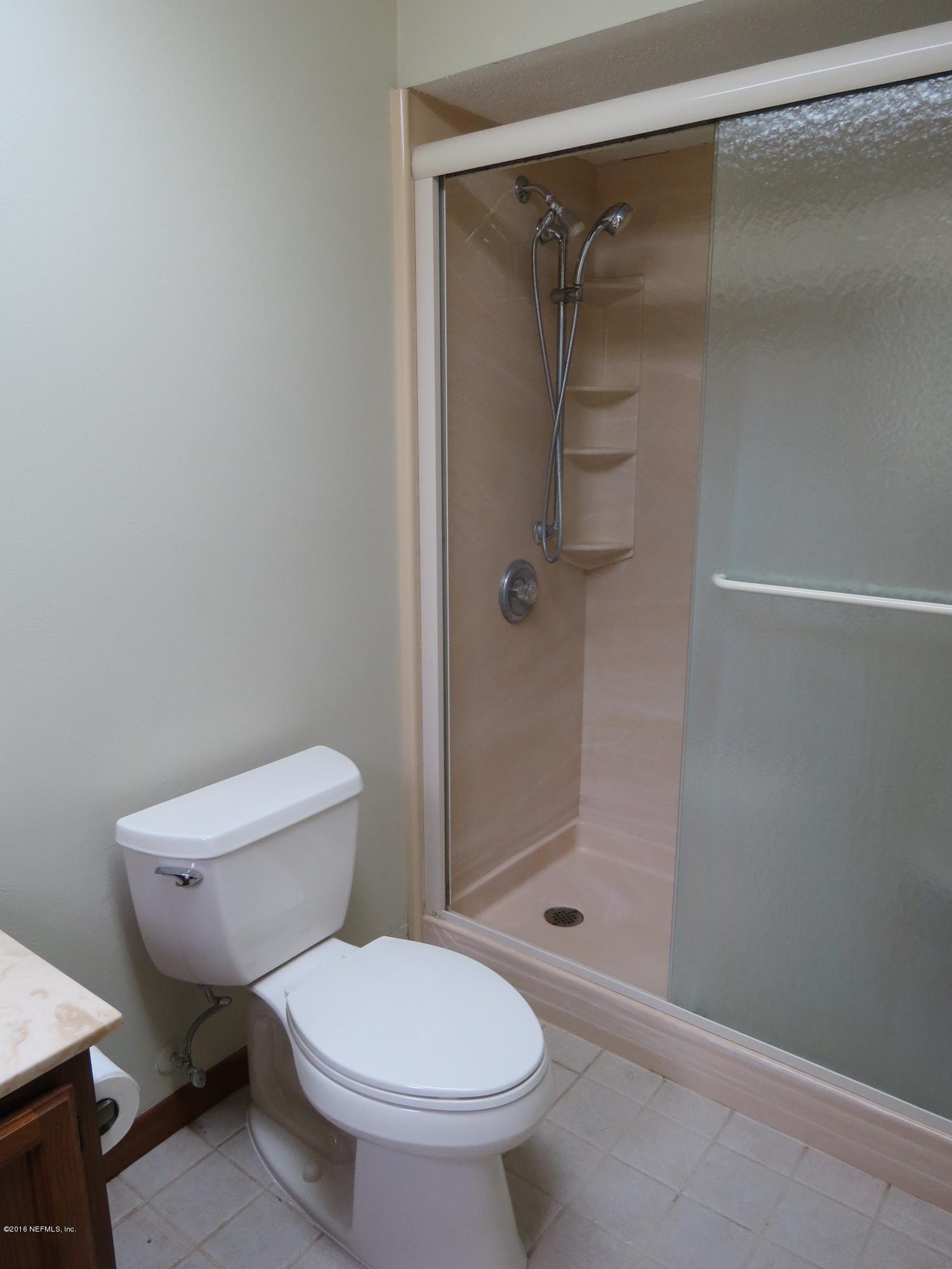 12770 Beaubien Road Jacksonville, FL 32258 - Photo 31 of 46 a bathroom with a toilet and a shower
