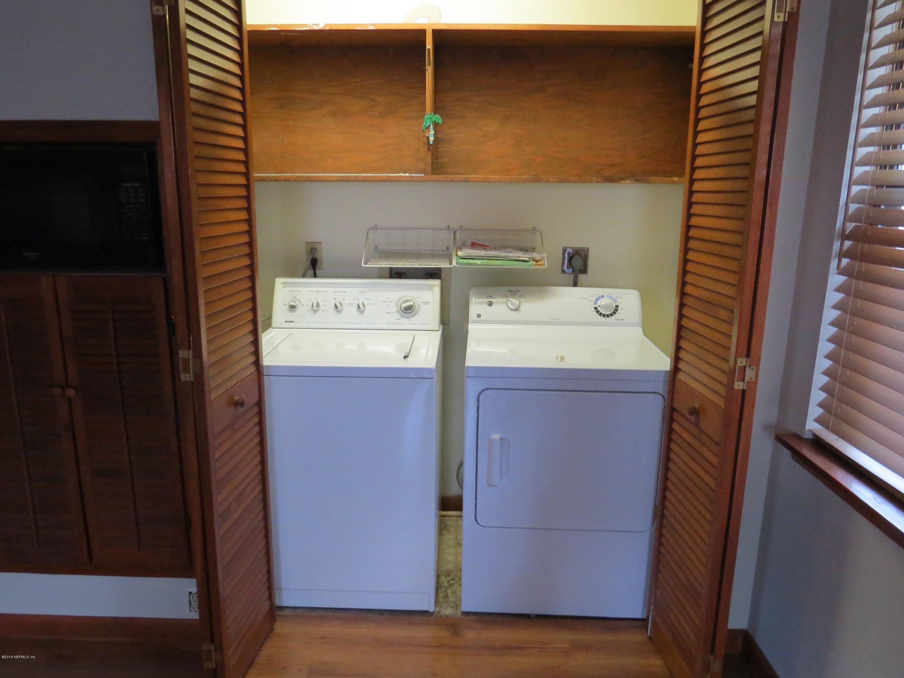 12770 Beaubien Road Jacksonville, FL 32258 - Photo 41 of 46 a utility room with dryer and washer