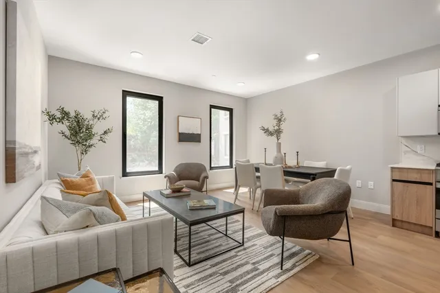 a living room with furniture and a table
