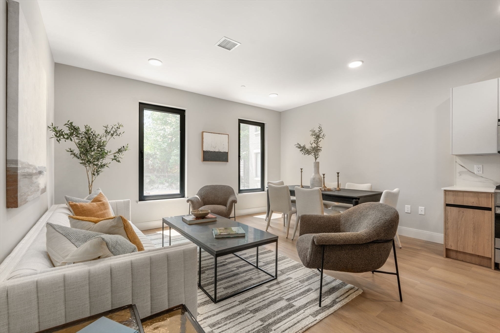 a living room with furniture and a table