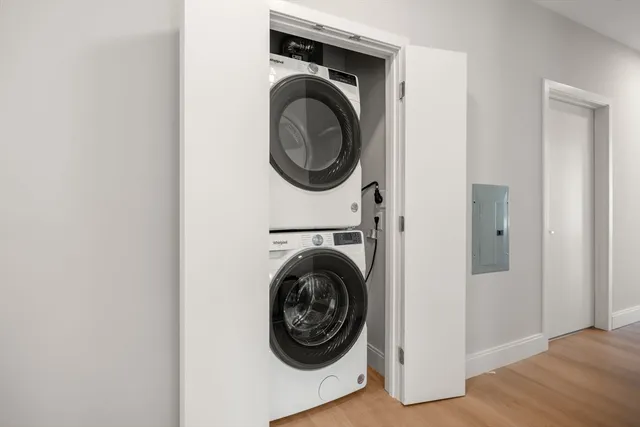 a view of a hallway with washer and dryer