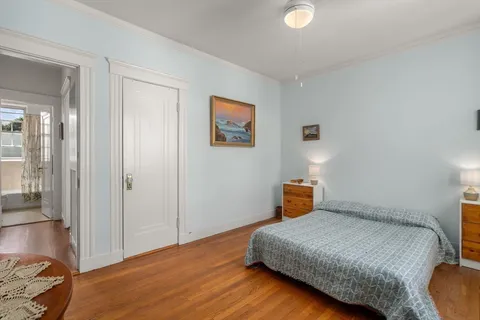 a bedroom with a bed and a workspace