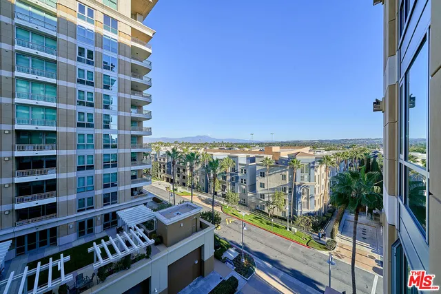 a view of swimming pool with outdoor seating and city view