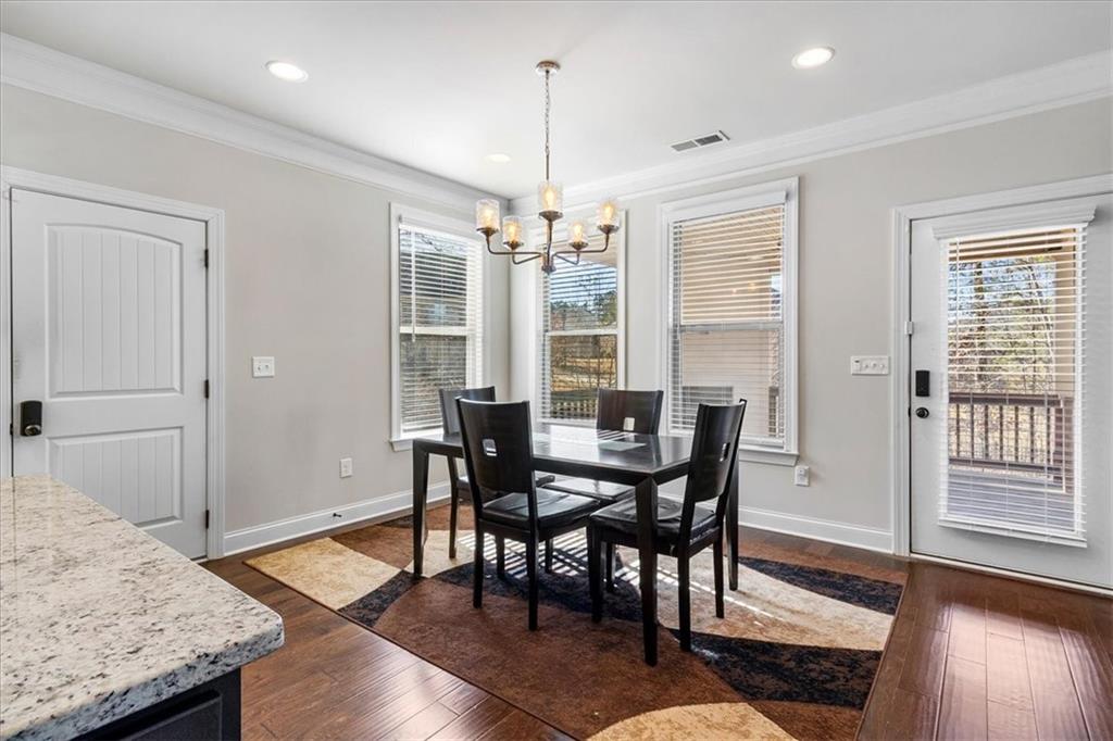 191 Crystal Lake Boulevard Hampton, GA 30228 - Photo 24 of 68 a view of a dining room with furniture window and wooden floor