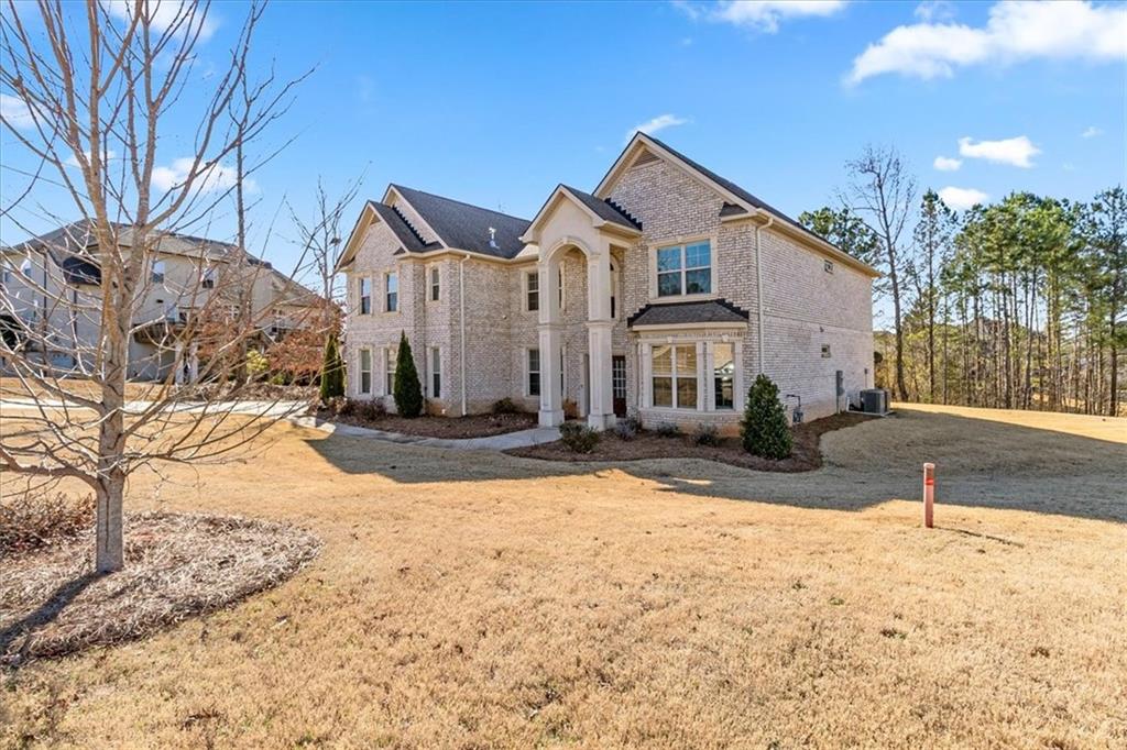 191 Crystal Lake Boulevard Hampton, GA 30228 - Photo 3 of 68 a view of a house with snow on the road