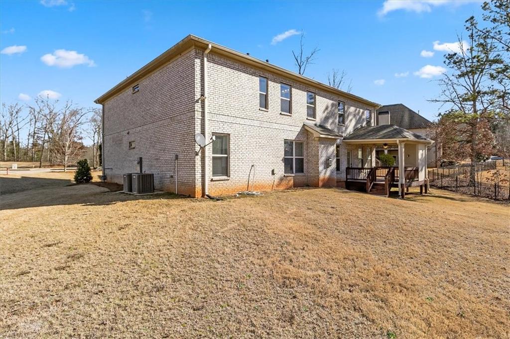 191 Crystal Lake Boulevard Hampton, GA 30228 - Photo 48 of 68 a front view of a building with a road