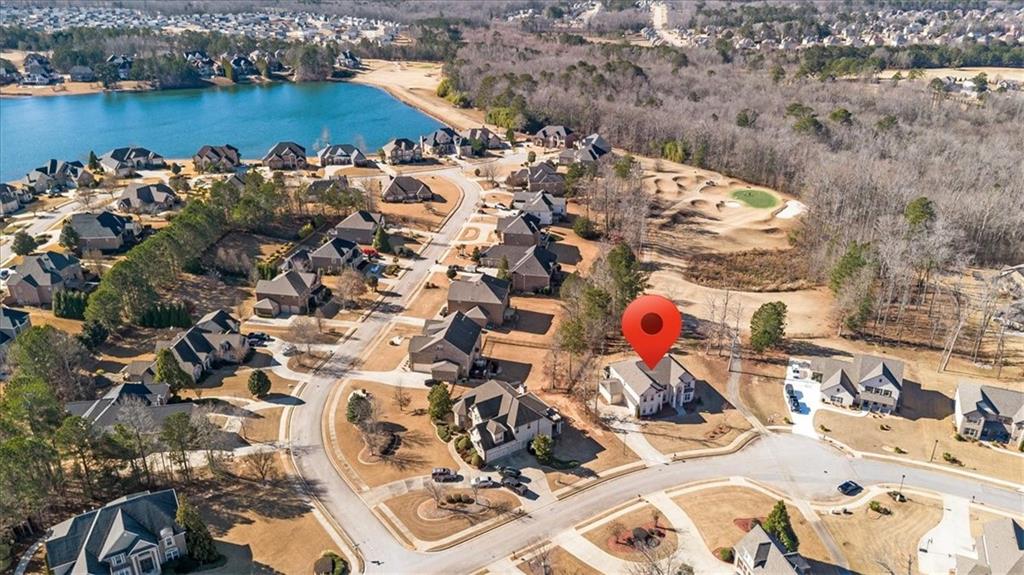 191 Crystal Lake Boulevard Hampton, GA 30228 - Photo 54 of 68 an aerial view of a house with a lake view