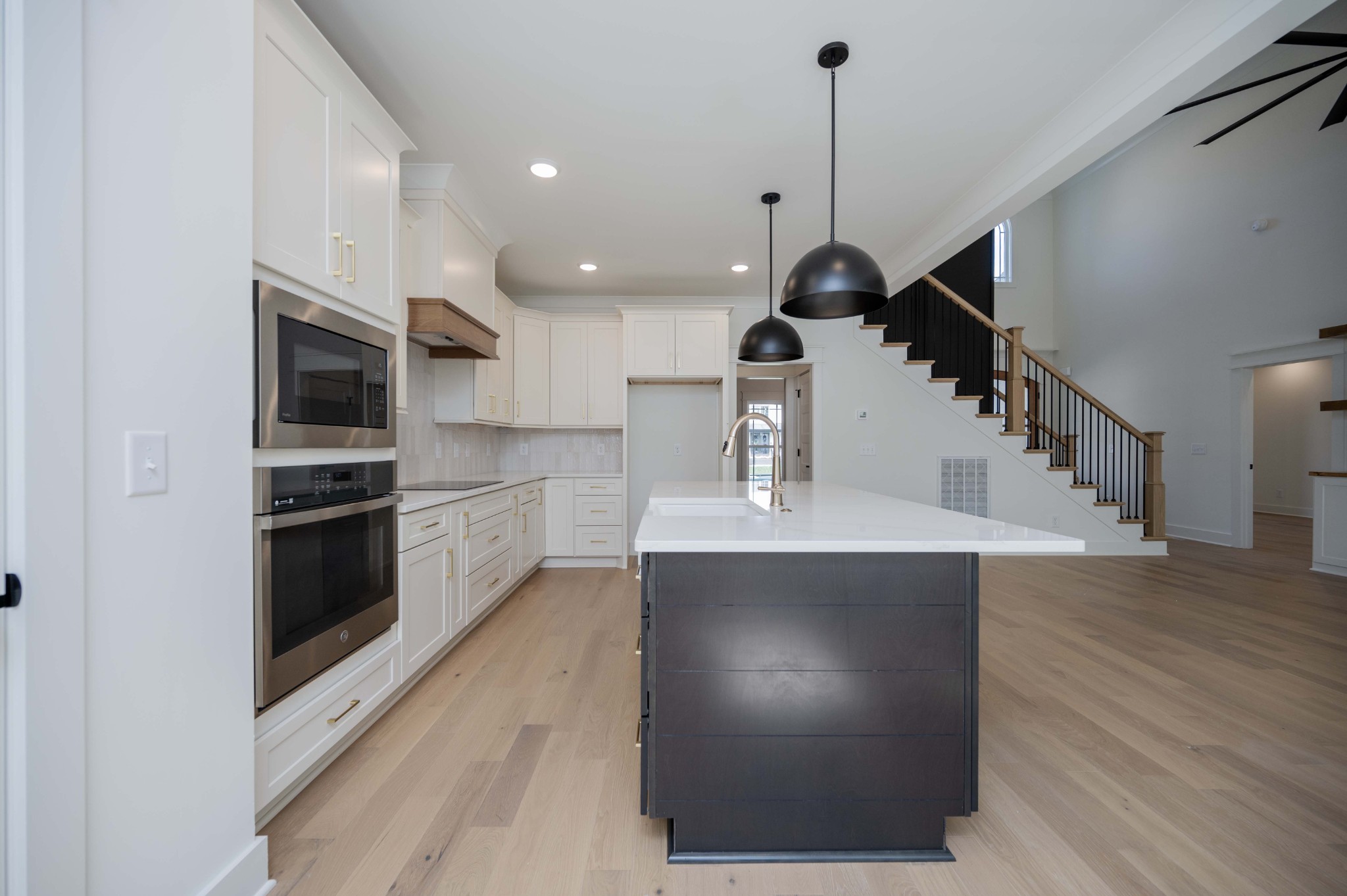 4 Holly Grove Road Lascassas, TN 37085 - Photo 13 of 37 a kitchen with kitchen island a sink stainless steel appliances and cabinets
