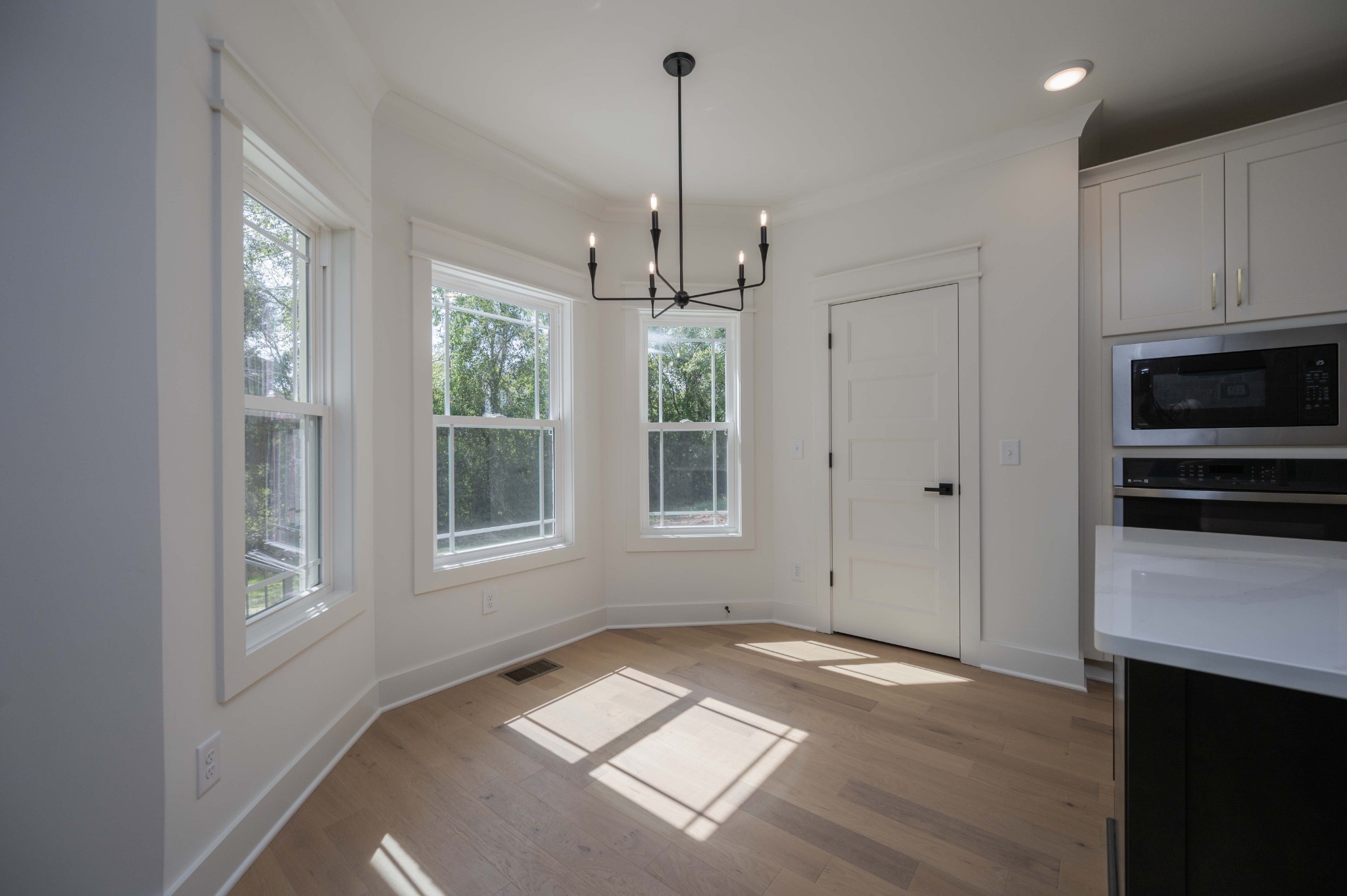 4 Holly Grove Road Lascassas, TN 37085 - Photo 14 of 37 a view of an empty room with window and cabinet with wooden floor