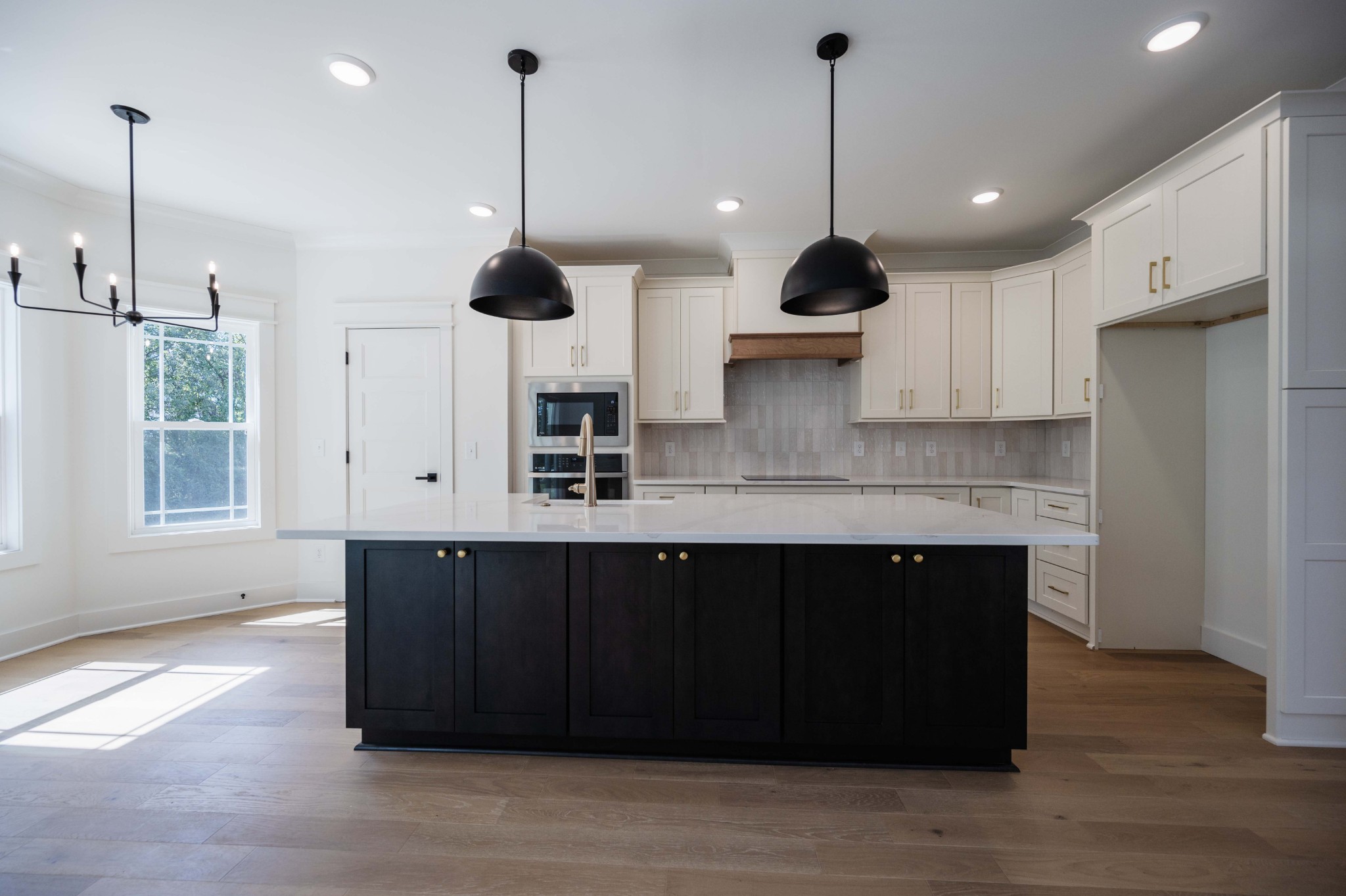 4 Holly Grove Road Lascassas, TN 37085 - Photo 15 of 37 a kitchen with stainless steel appliances granite countertop a sink a window and a wooden floor