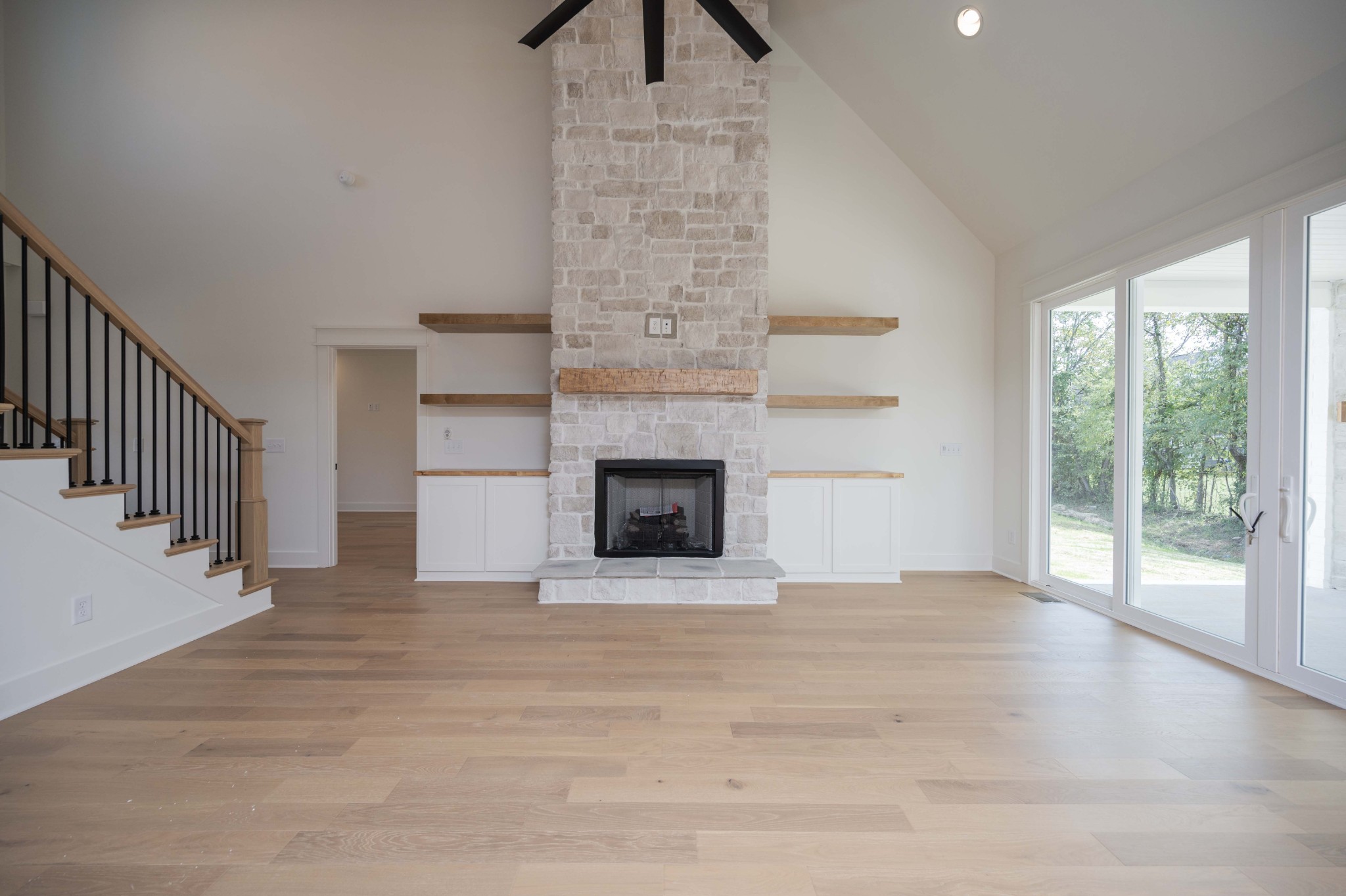 4 Holly Grove Road Lascassas, TN 37085 - Photo 6 of 37 a view of an empty room with a fireplace and a window