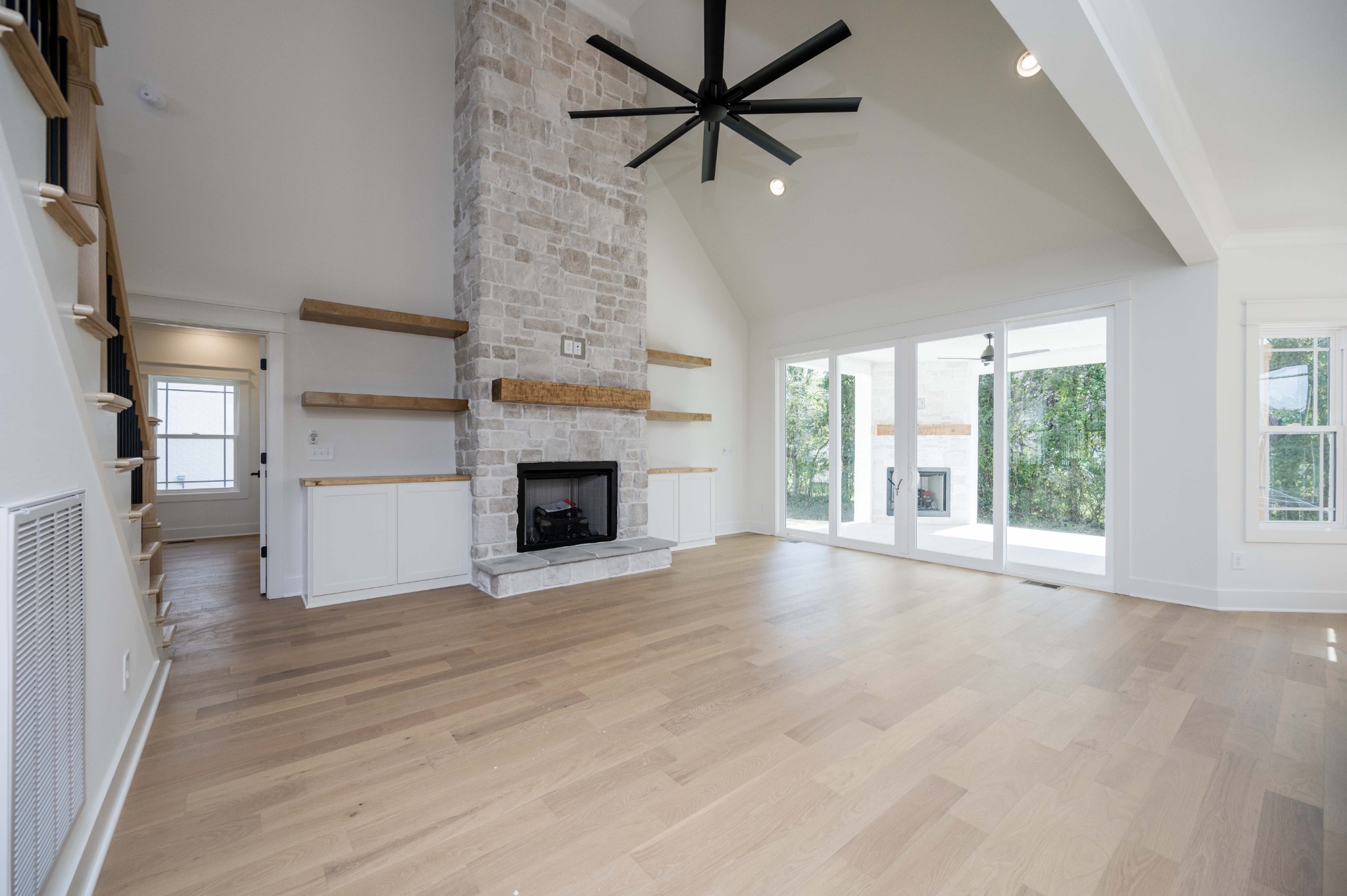 4 Holly Grove Road Lascassas, TN 37085 - Photo 7 of 37 a view of empty room with wooden floor and fan