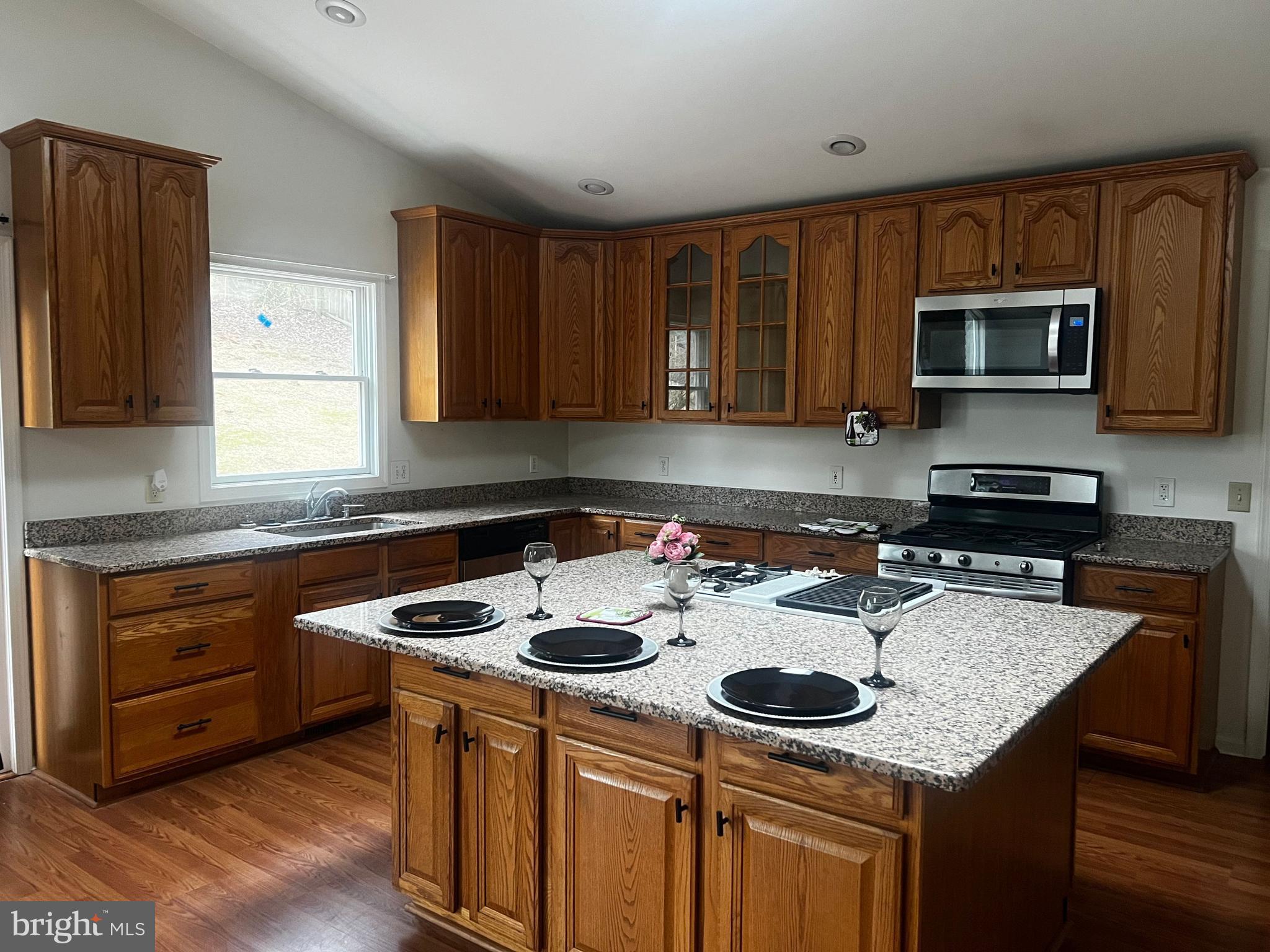 11009 Maiden Drive Bowie, MD 20720 - Photo 3 of 5 a kitchen with stainless steel appliances granite countertop a sink stove and microwave