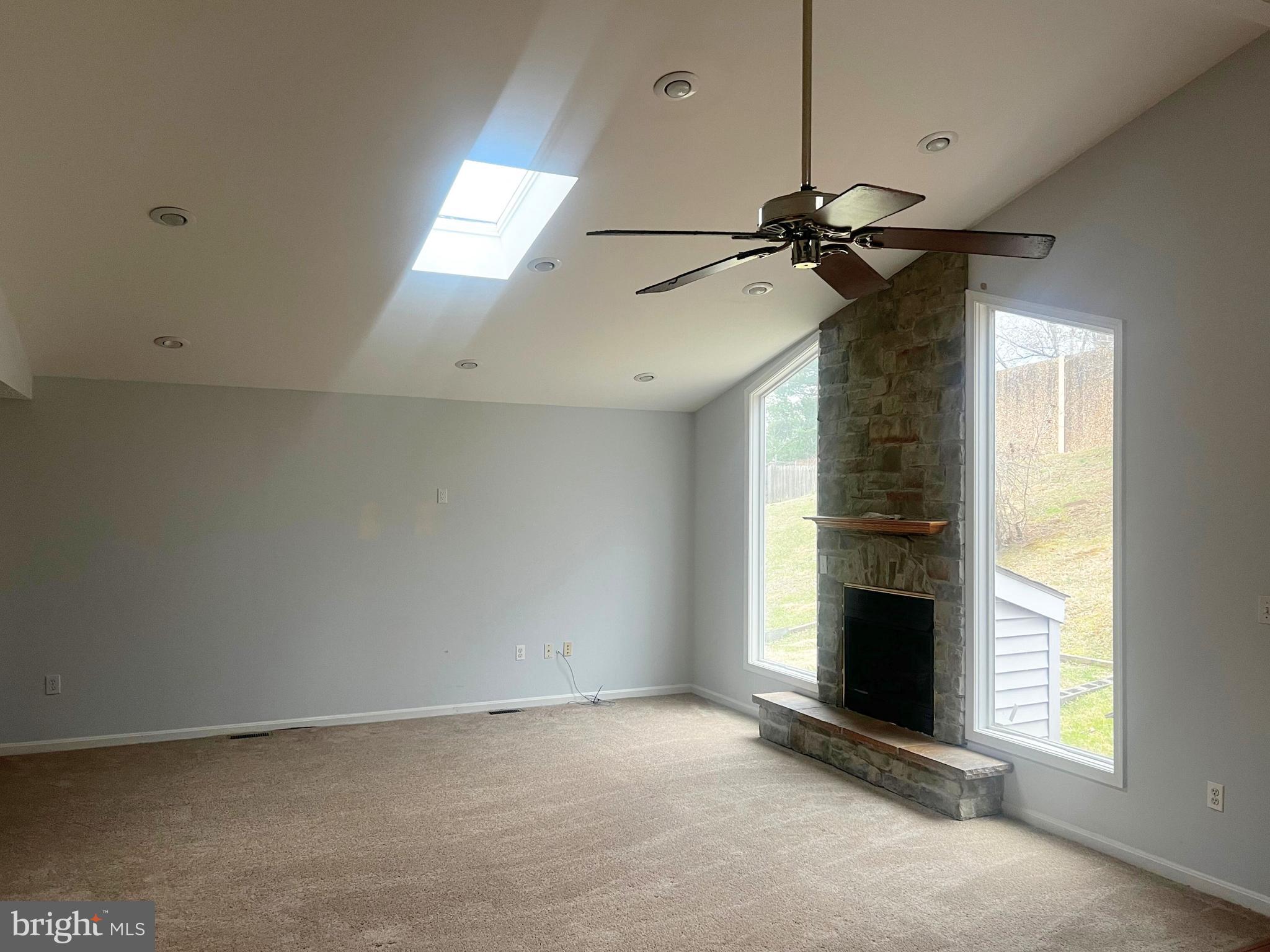 11009 Maiden Drive Bowie, MD 20720 - Photo 4 of 5 a view of empty room with fireplace and fan