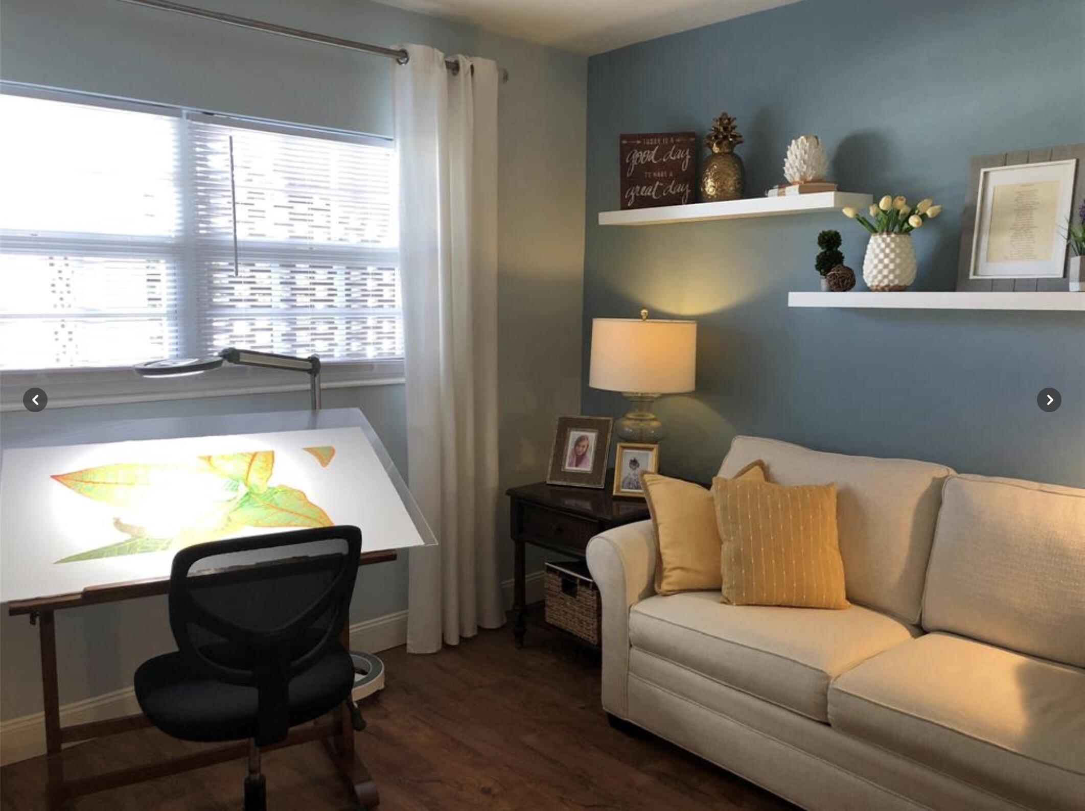 1951 Northeast 39th Street Northeast, Unit 249 Lighthouse Point, FL 33064 - Photo 12 of 23 a living room with a couch and a table