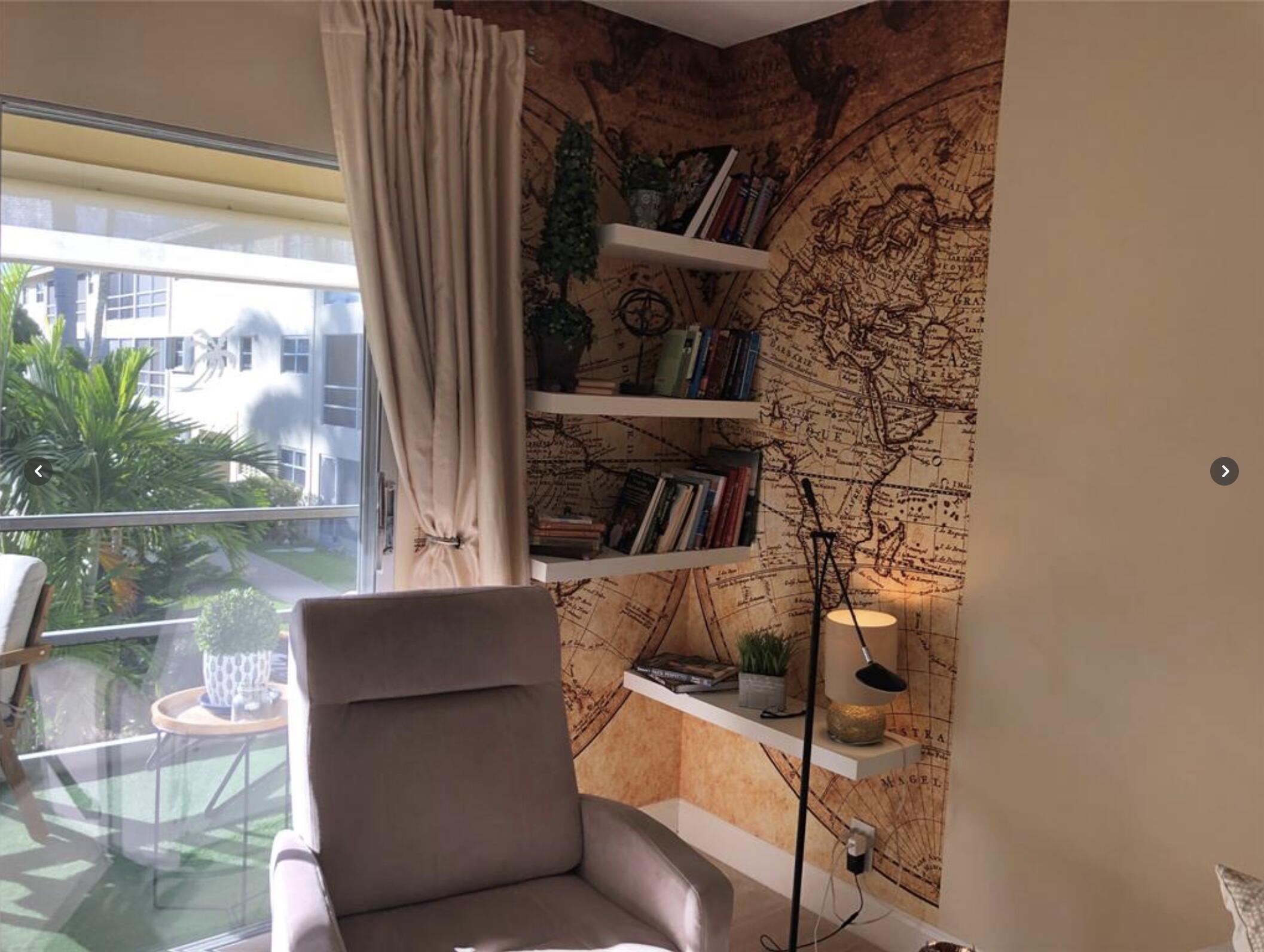 1951 Northeast 39th Street Northeast, Unit 249 Lighthouse Point, FL 33064 - Photo 16 of 23 a living room with furniture and a floor to ceiling window