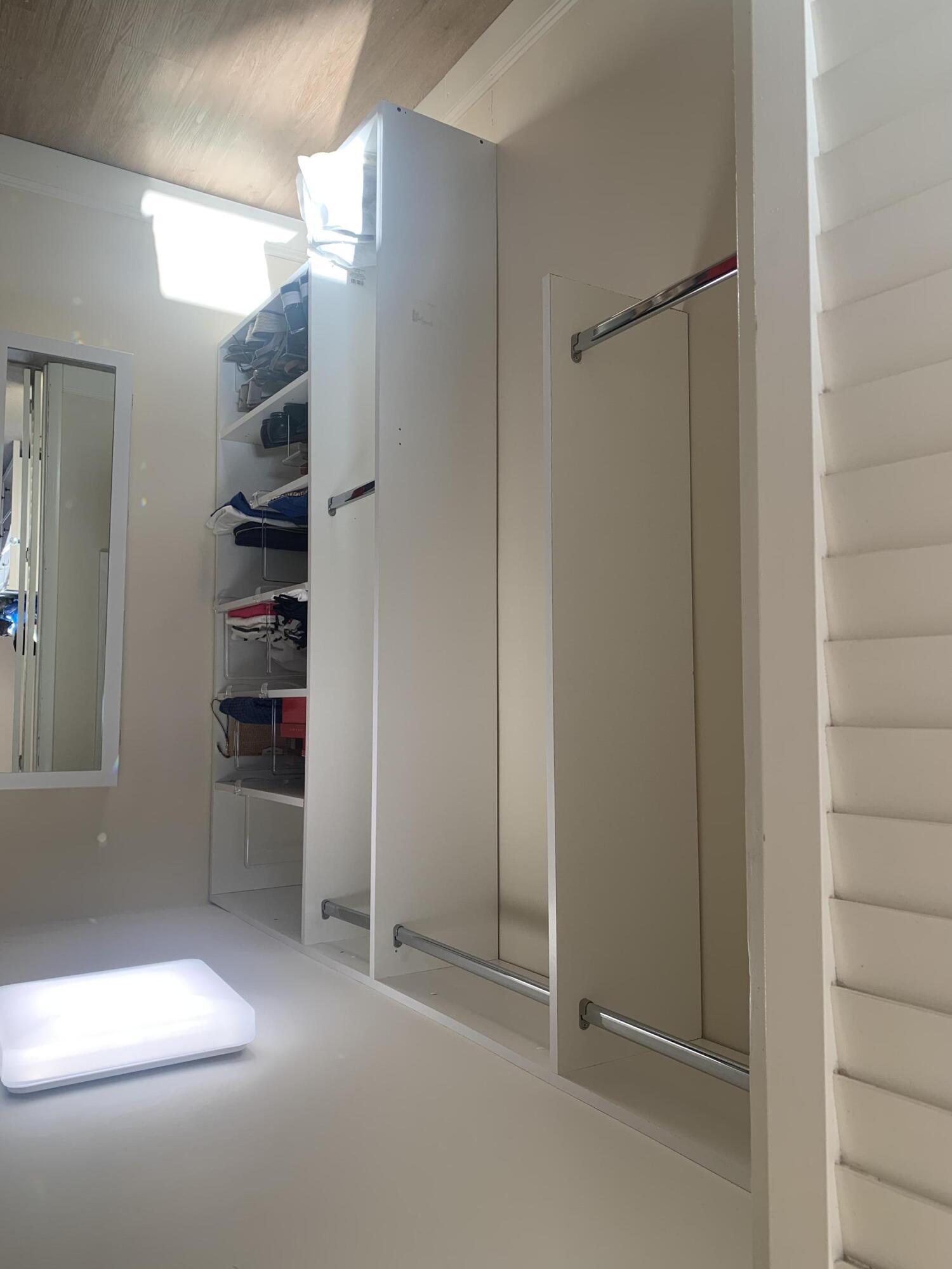 1951 Northeast 39th Street Northeast, Unit 249 Lighthouse Point, FL 33064 - Photo 17 of 23 a view of walk in closet with empty racks